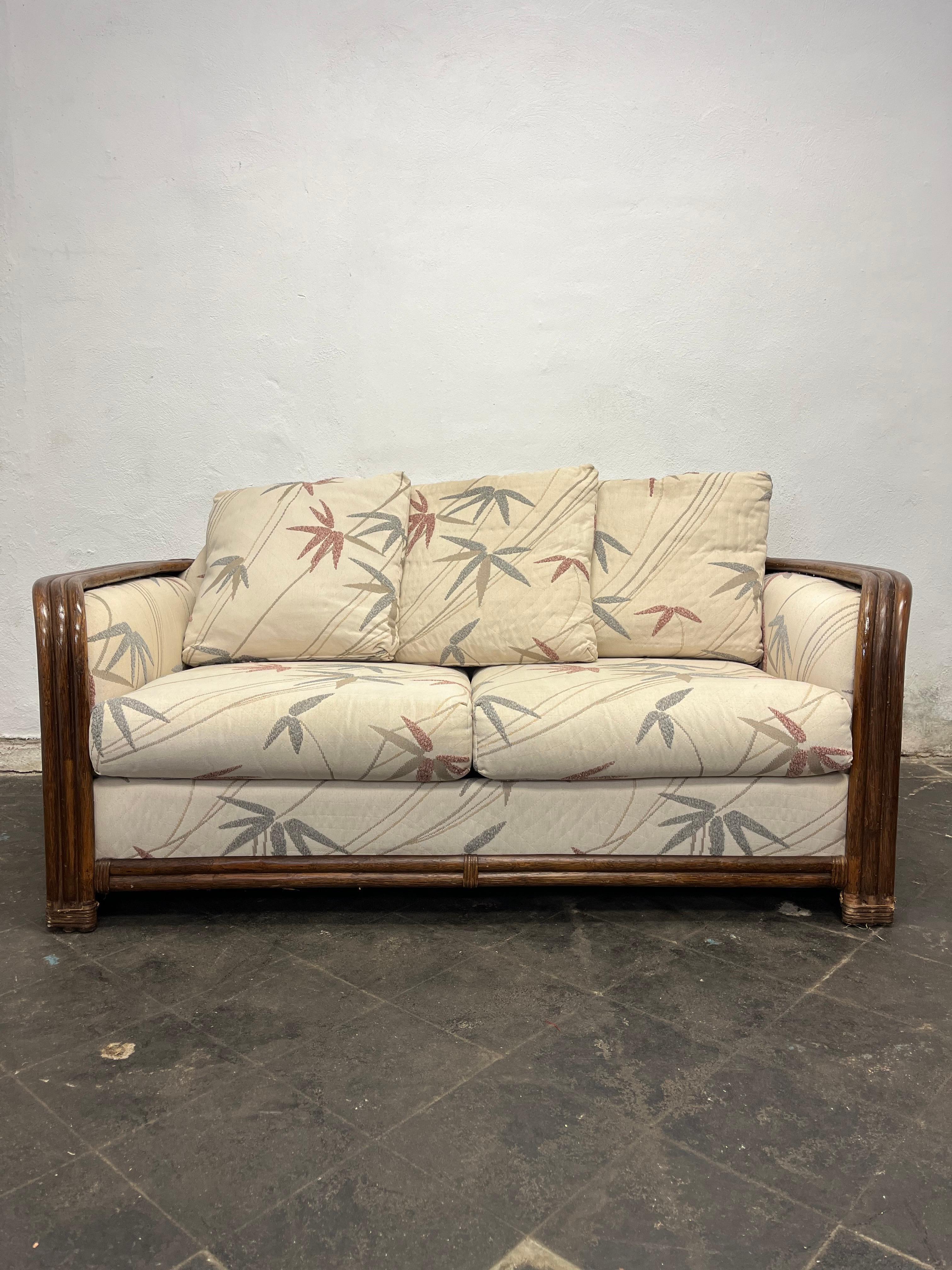Flat fanned bamboo and rattan sofa with botanical upholstered seating and back. 
Curbside to NYC/Philly $400