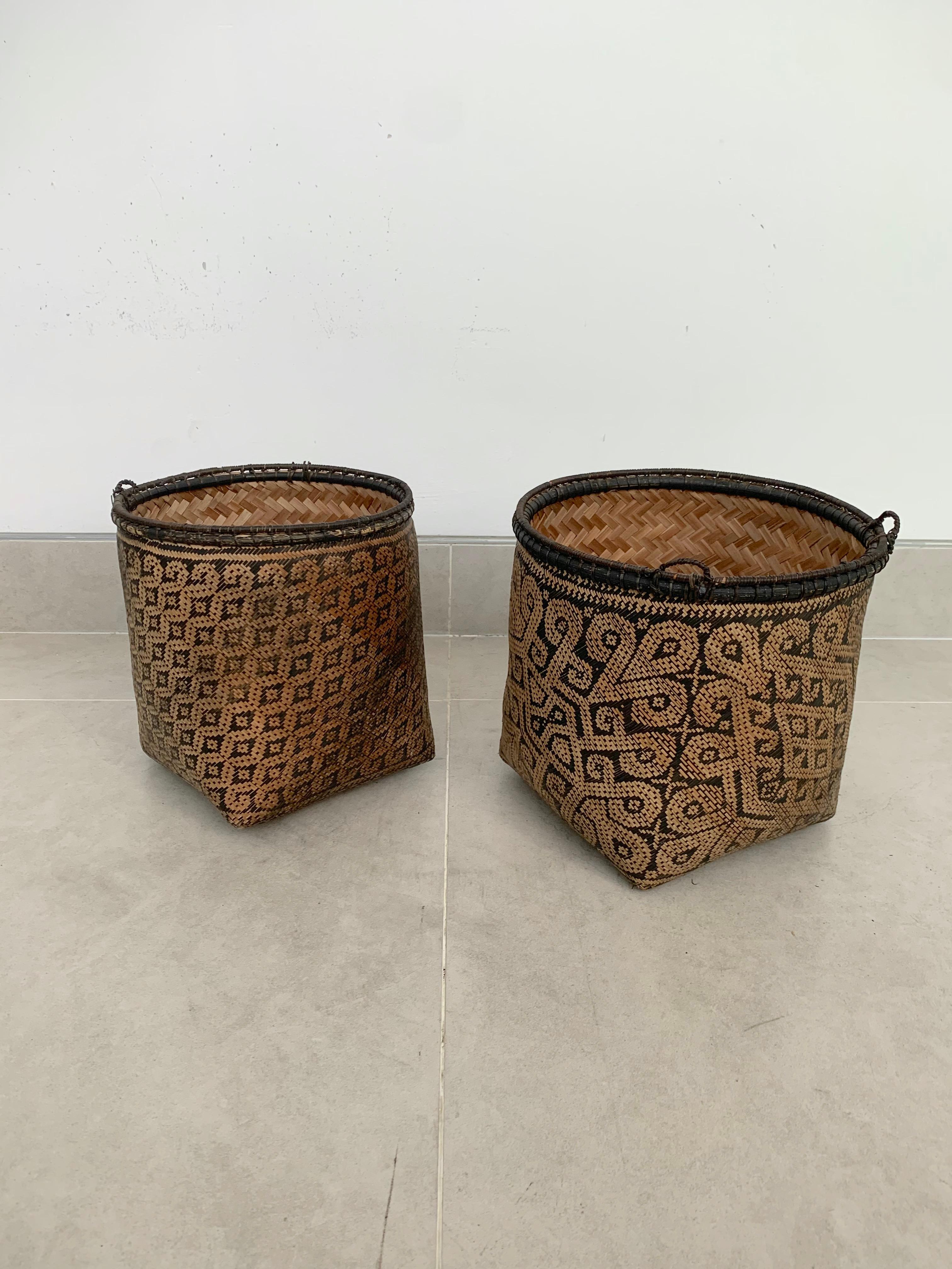 These vintage hand-woven baskets, circa year 2008 originate from the Dayak tribe of Borneo. Crafted with rattan fibres, these baskets were used to carry leaves, fruit, grain and wood and features wonderfully aged fibres and wood patina. These