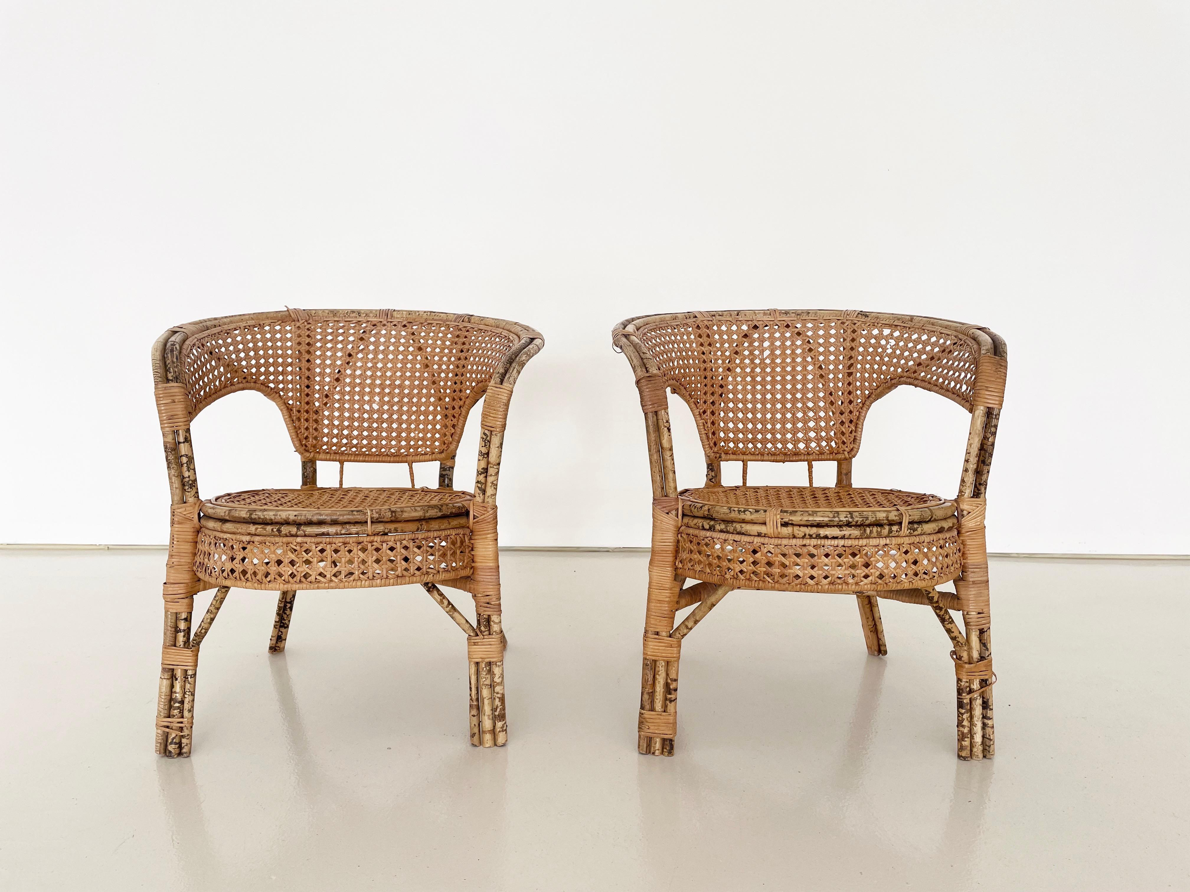 Midcentury bent bamboo Rattan and Cane Armchairs, Set of 2

Minor flaking of the clear coat in a few places on each chair (see images)

No structural damage

A few small spots of missing wrapped flat Rattan on the legs, no structural concerns.