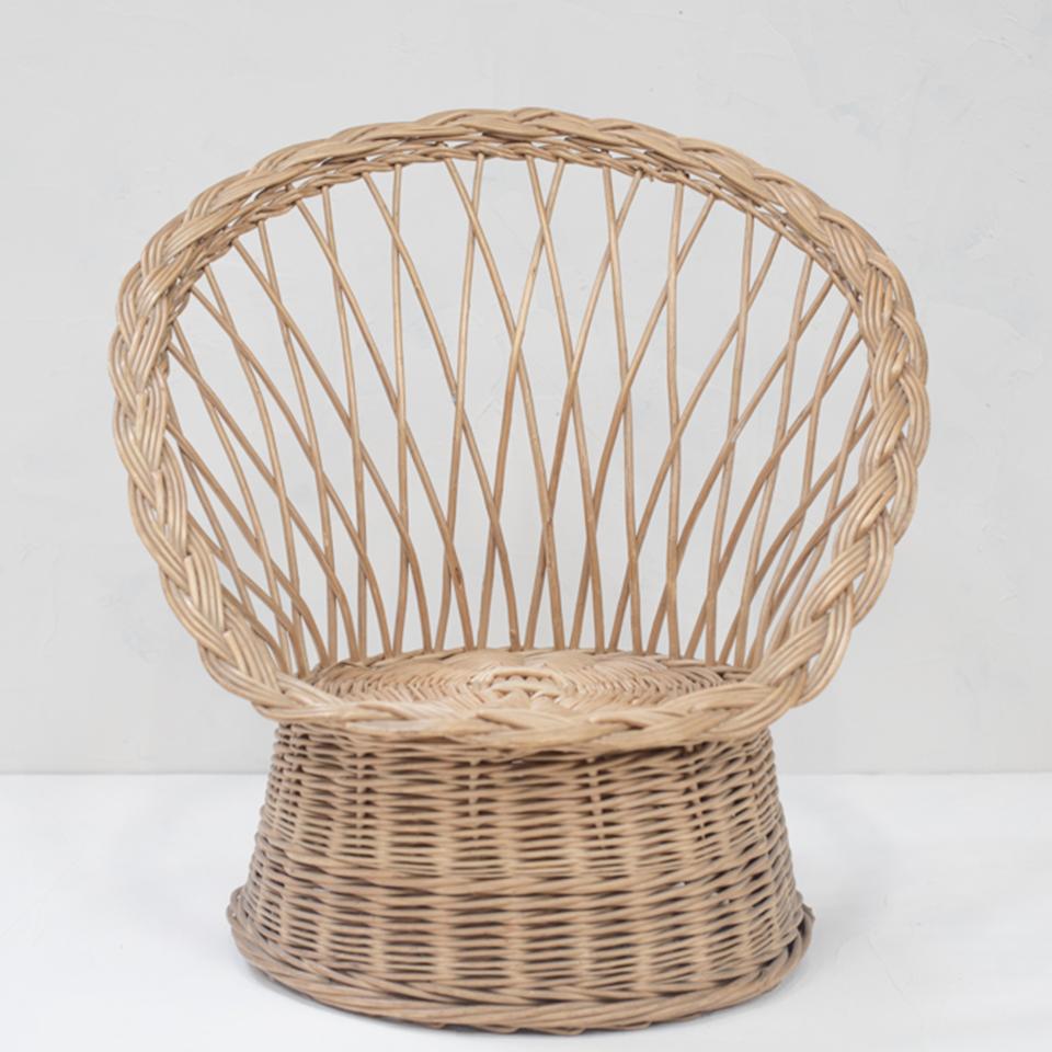 Beautifully woven wing back rattan armchair from France.
