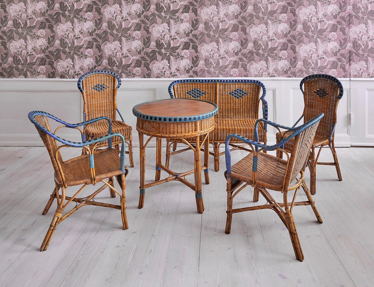 France, 1930s

Beautiful and rare complete furniture set consisting of a rattan sofa, two rattan chairs, two rattan armchairs and a rattan table, all with elegantly woven details in blue.

Measures: Sofa: H 80 x W 110 x D 54 cm

Armchairs: H