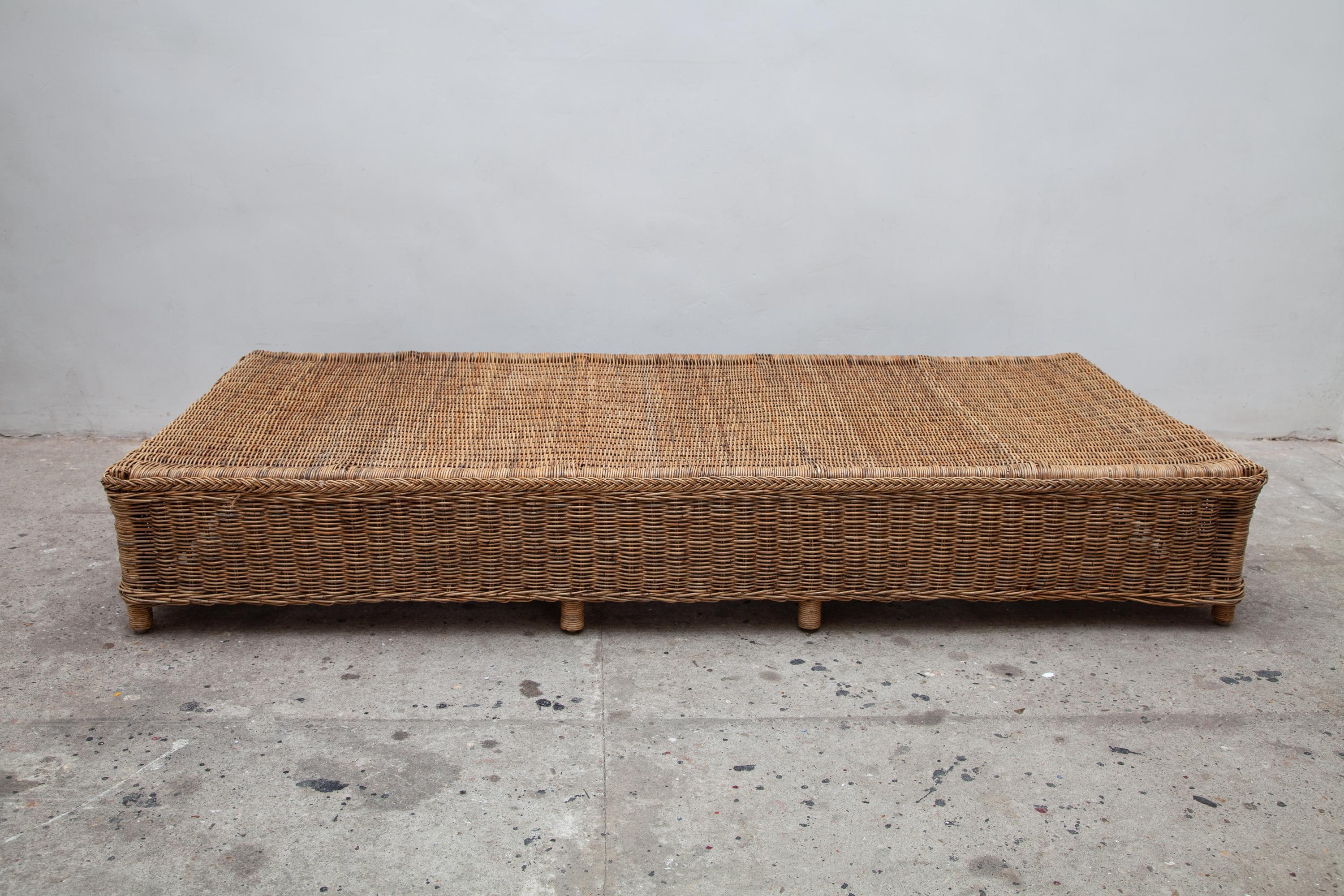 Vintage rattan daybed. Sturdy frame with a beautiful braided edge. Can be styled with any pillows or cushions.
Measures: 192 W x 87 D x 30 H cm.