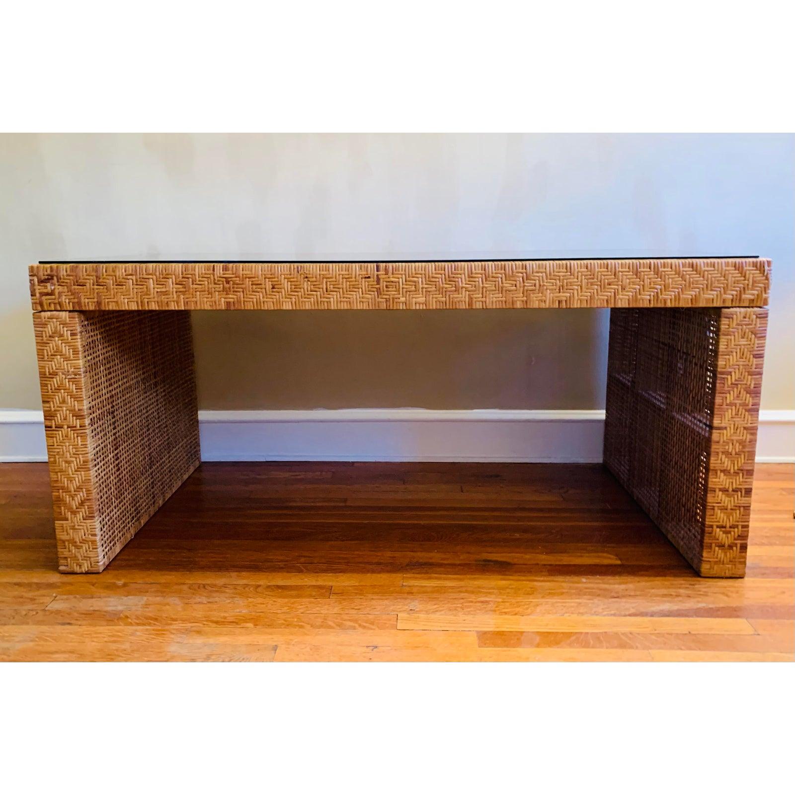 Handcrafted in the 1960s or early 1970s. Truly excellent condition.

This table has a piece of smoked glass that was cut for the top- we much prefer how it looks without it (so that one may see the craftsmanship).

Of course, woven rattan makes