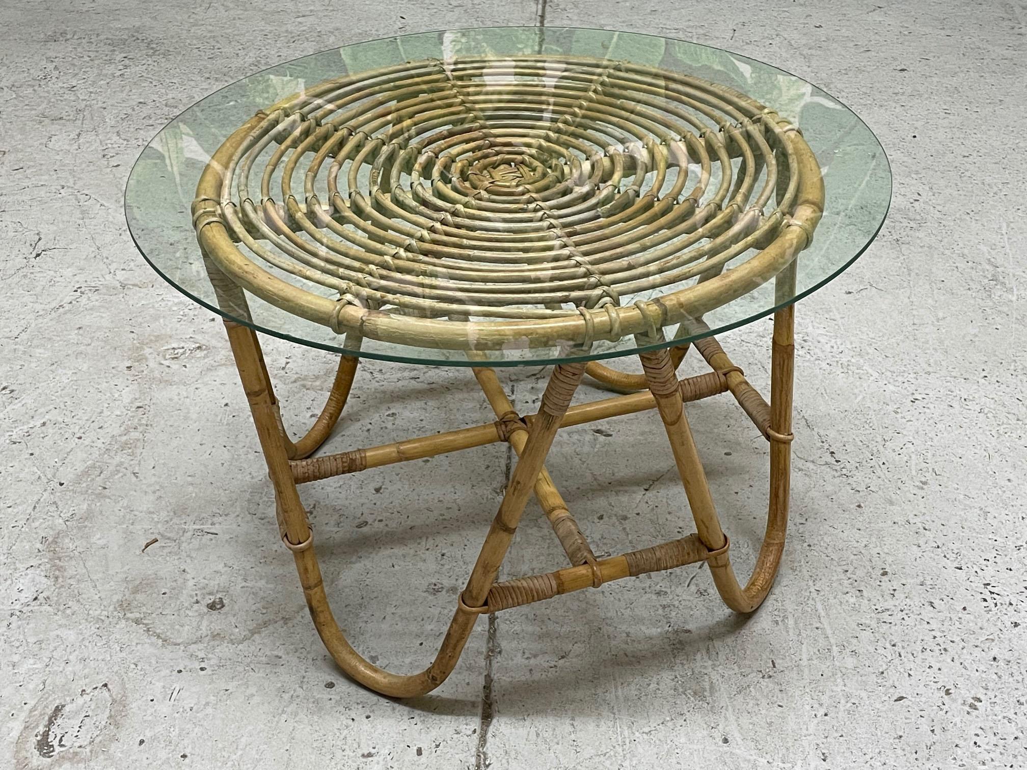 Vintage rattan side table features boho chic styling and a glass top. Good condition with minor imperfections consistent with age. May exhibit scuffs, marks, or wear, see photos for details.

 