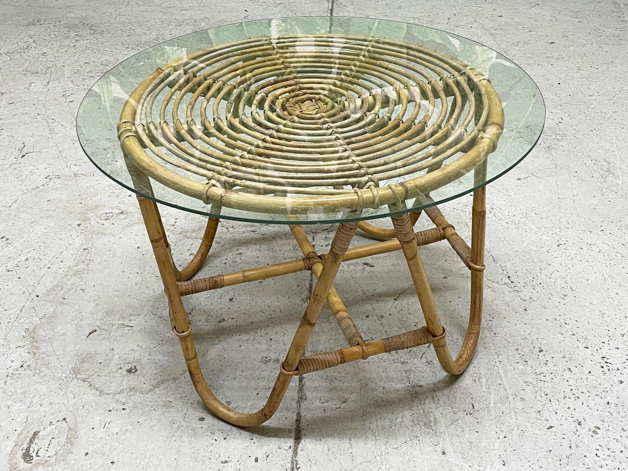 Vintage rattan side table features boho chic styling and a glass top. Good condition with minor imperfections consistent with age, see photos for condition details.
For a shipping quote to your exact zip code, please message us.
