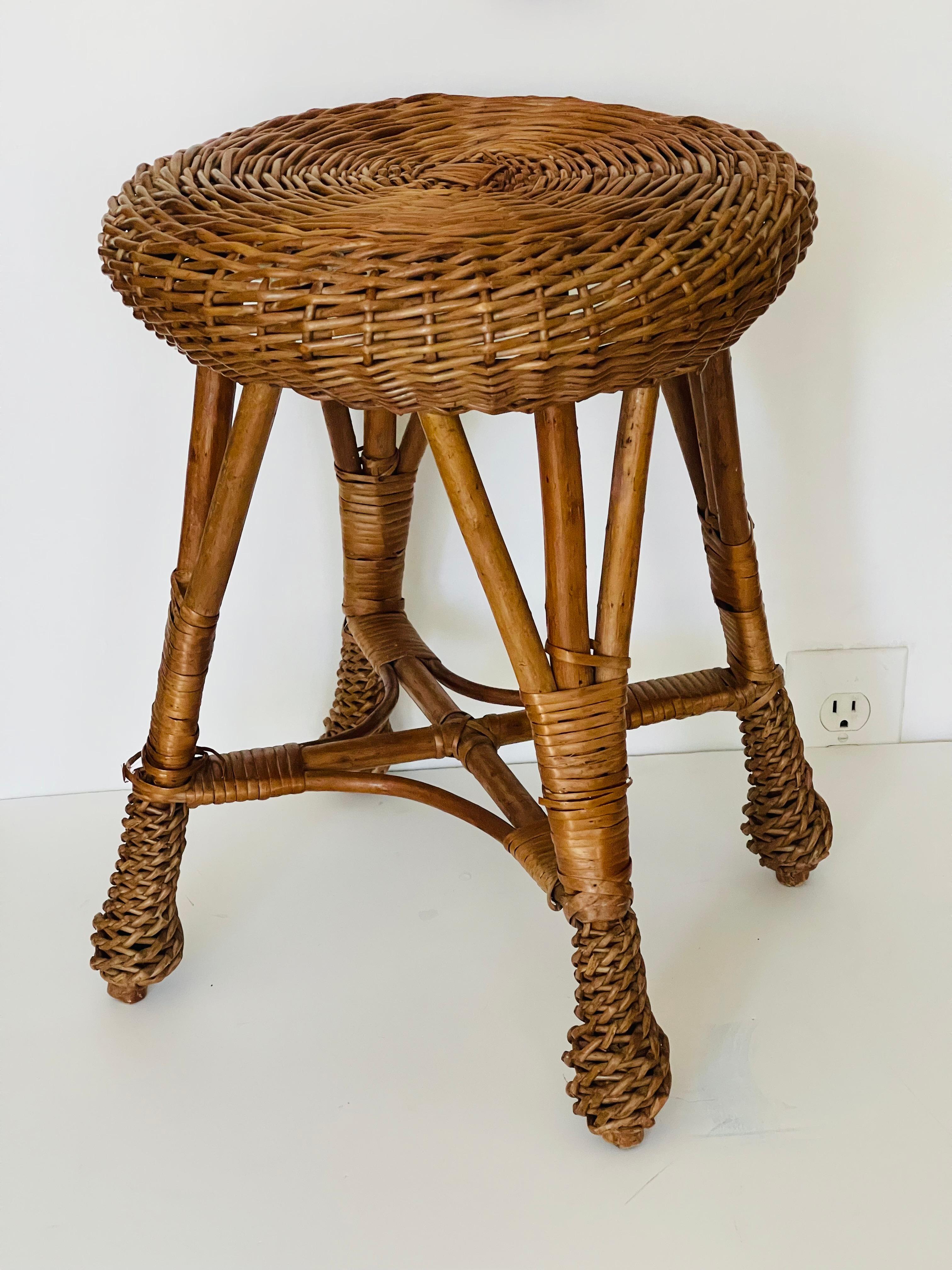 Vintage handwoven rattan stool or plant stand.