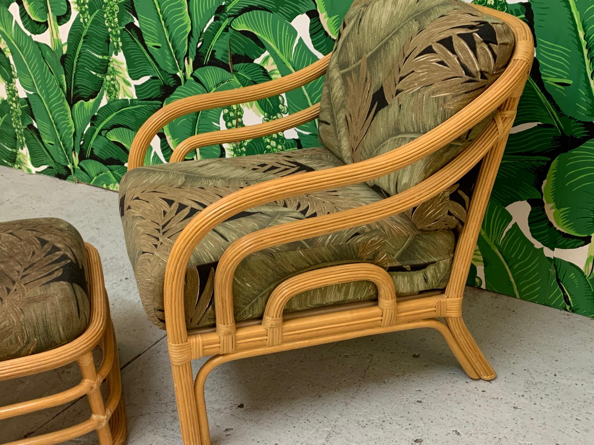 Vintage rattan lounge chair and matching ottoman feature a pencil reed or split reed frame and stacked horizontal design. Good condition with minor imperfections consistent with age. Chair measures 28