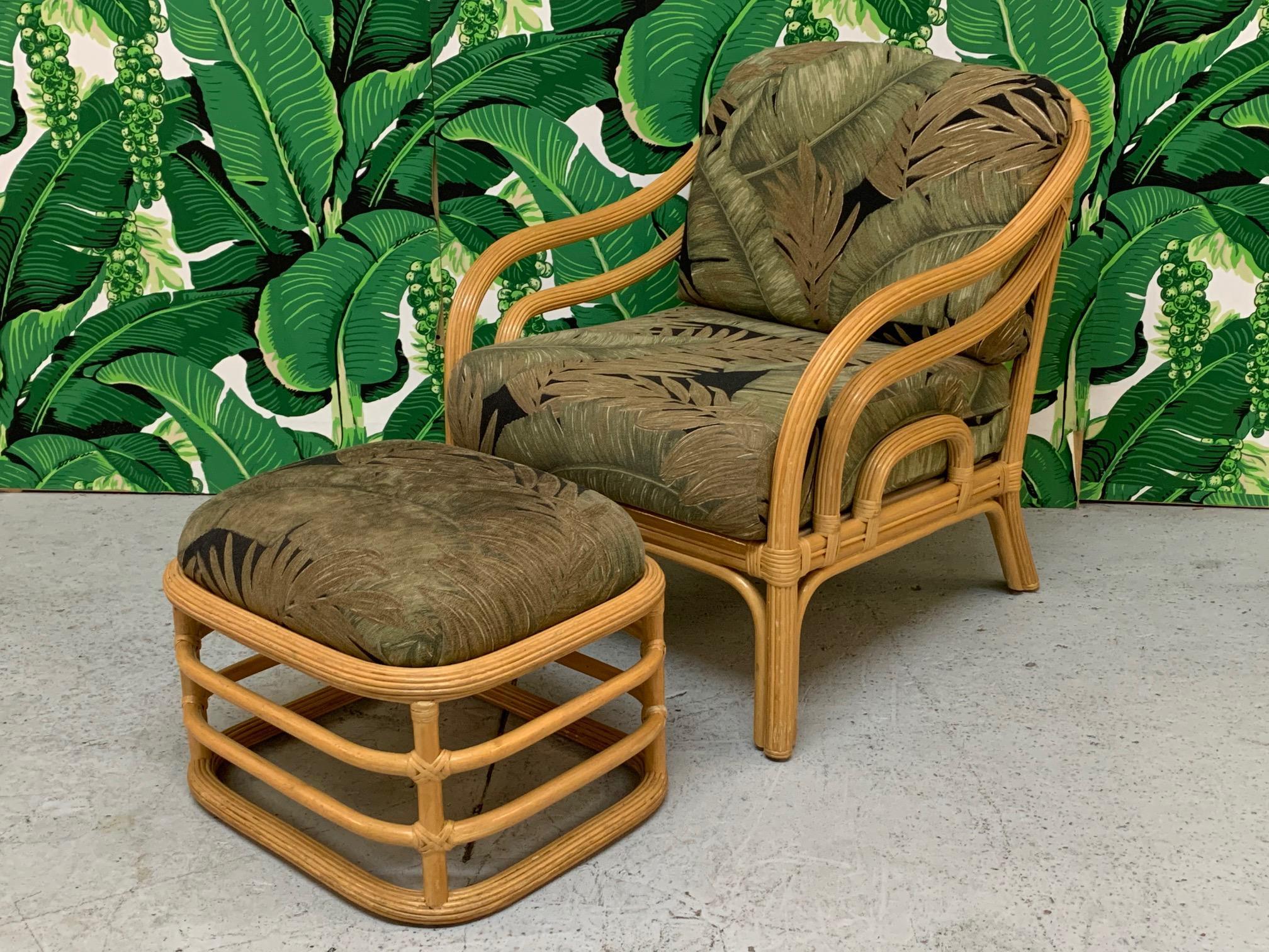 Vintage rattan lounge chair and matching ottoman feature a pencil reed or split reed frame and stacked horizontal design. Good condition with minor imperfections consistent with age. Chair measures 28