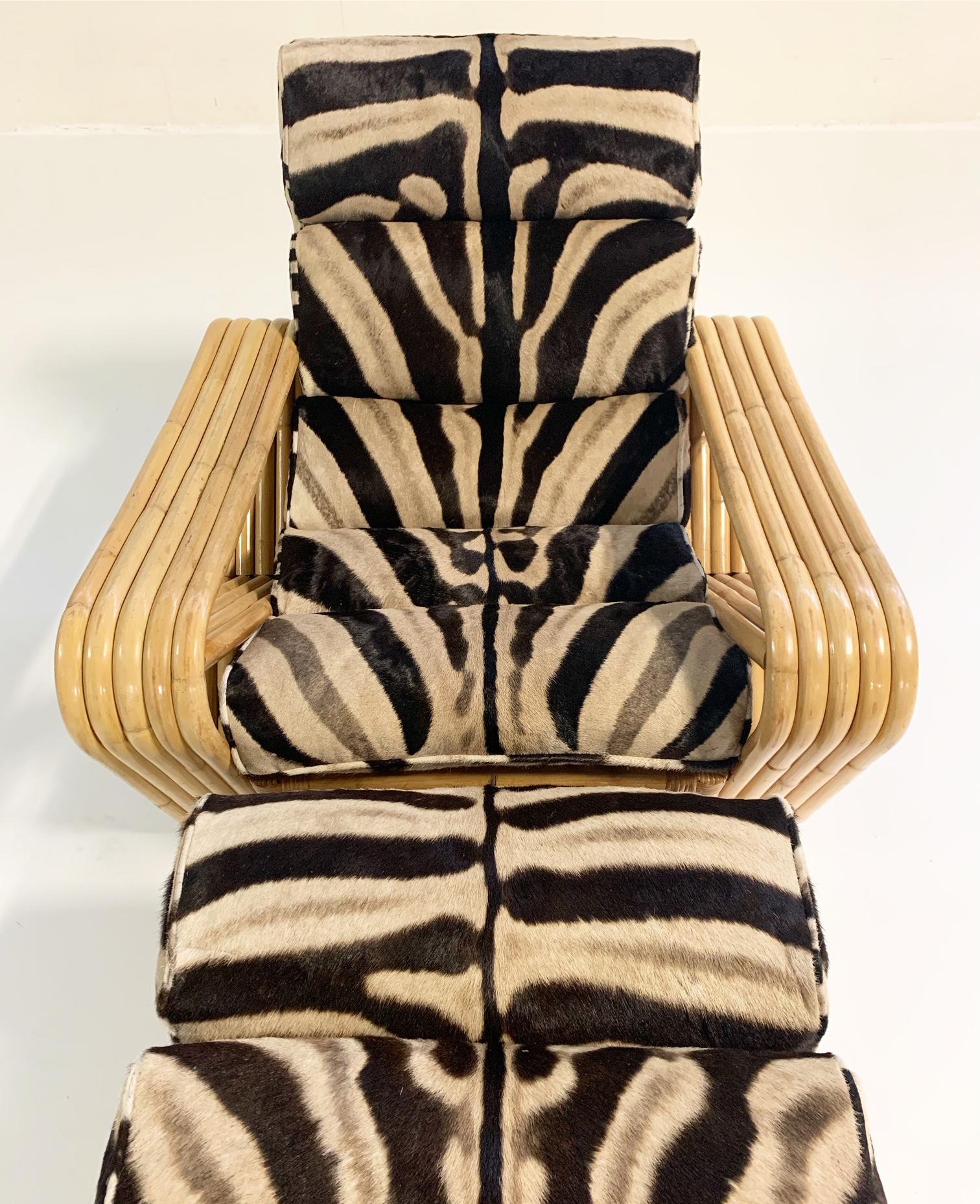 Whoa. This Paul Frankl style lounge chair and ottoman have magnetism. The sloping, rolling, luxurious zebra hide cushions generously stuffed with feathers. The curves and bends of the gorgeous rattan. Zebra hide and rattan are a match made in design