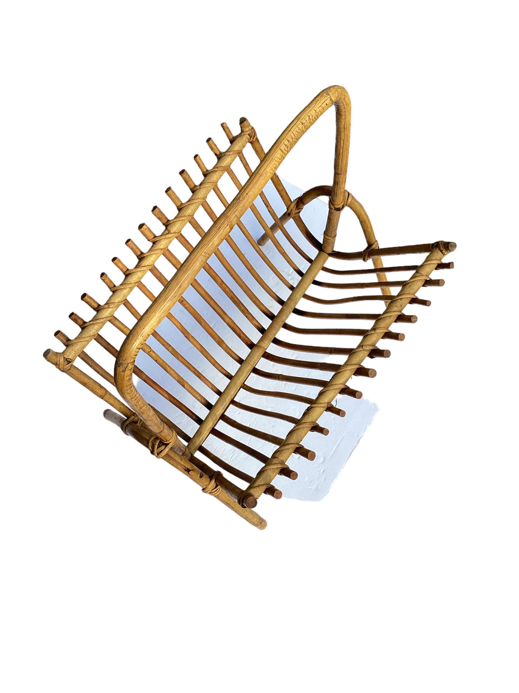 Vintage Rattan Magazine Rack in the style of Franco Albini. Versatile and useful item that can also be used for holding records. In very good vintage condition with no obvious signs of damage.