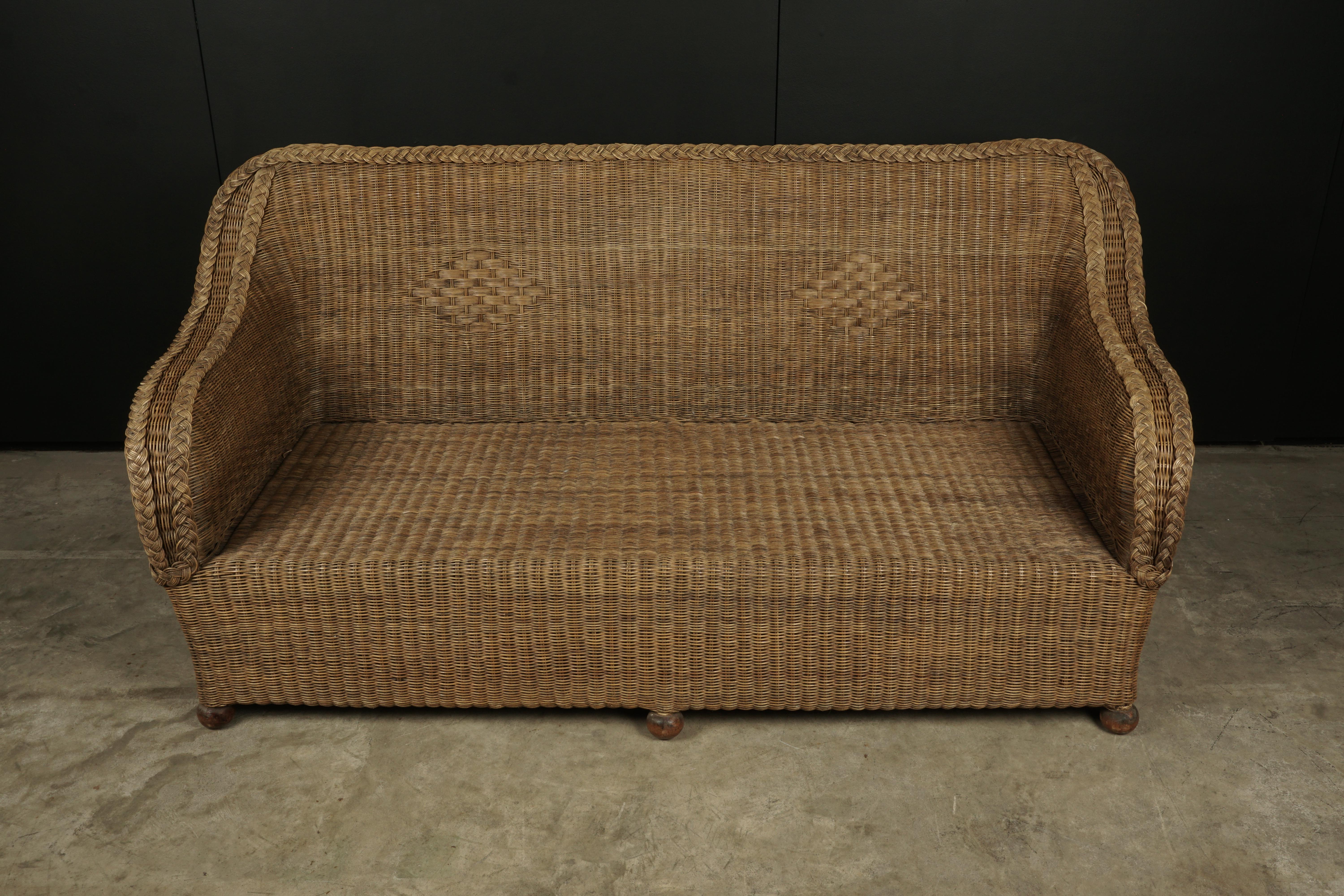 Vintage Rattan sofa from France, 1950s. Solid bamboo and rattan construction. Original cushion included. Light wear and use.