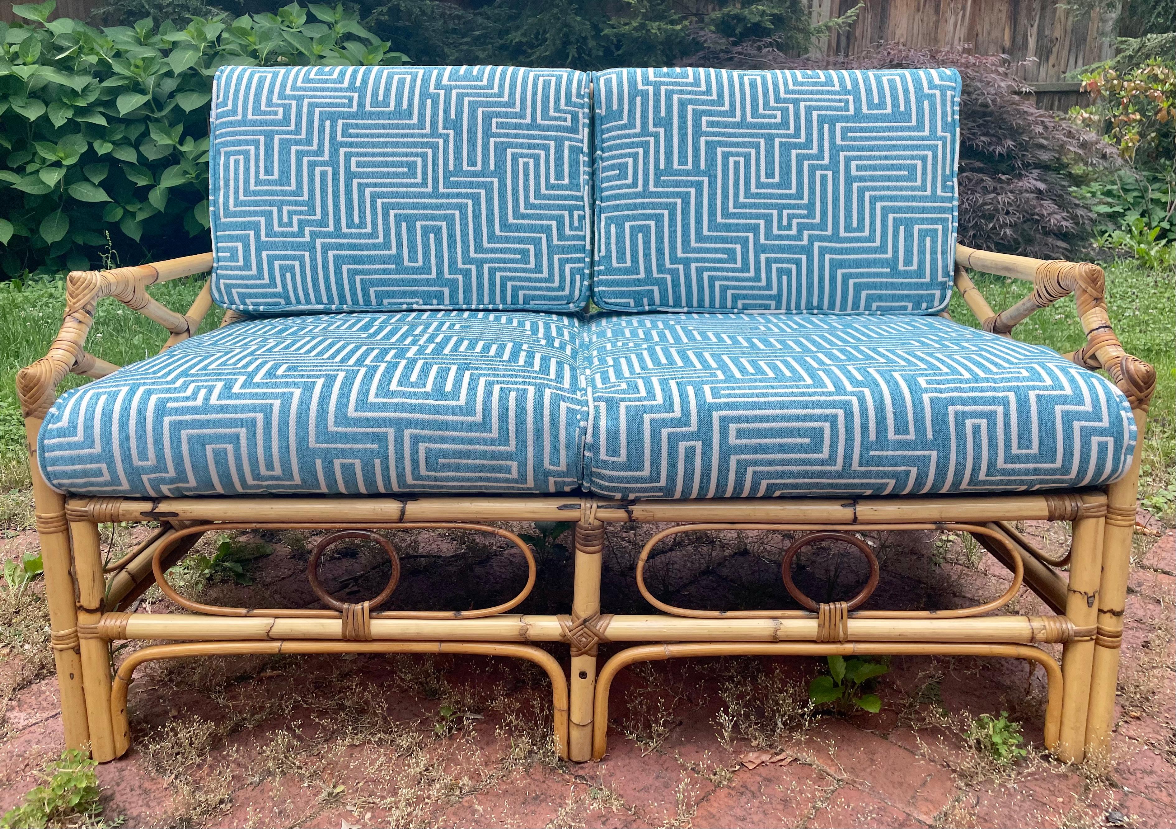 This vintage rattan set features the original finish with fresh decking on the underside and brand new designer upholstery! This listing is for the sofa specifically.

Sofa
W 47” x D 24” x H 30.5”

Lounge chairs x2
W 24” X D 24.5” x H