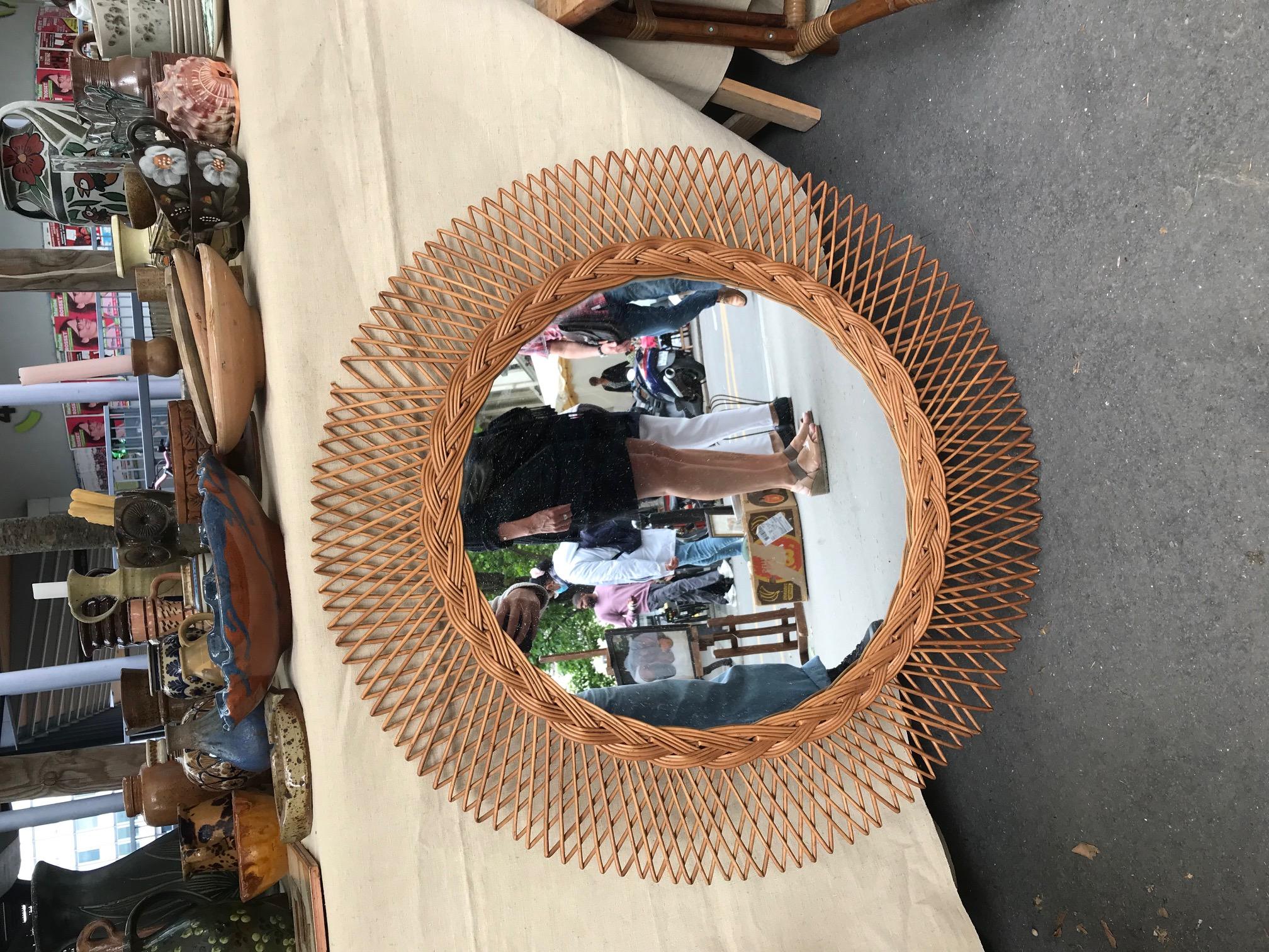 Rare large sun rattan mirror in very good state perfect for a living room, a bedroom or even a bathroom. It gives a natural organic atmosphere that fit with any style.