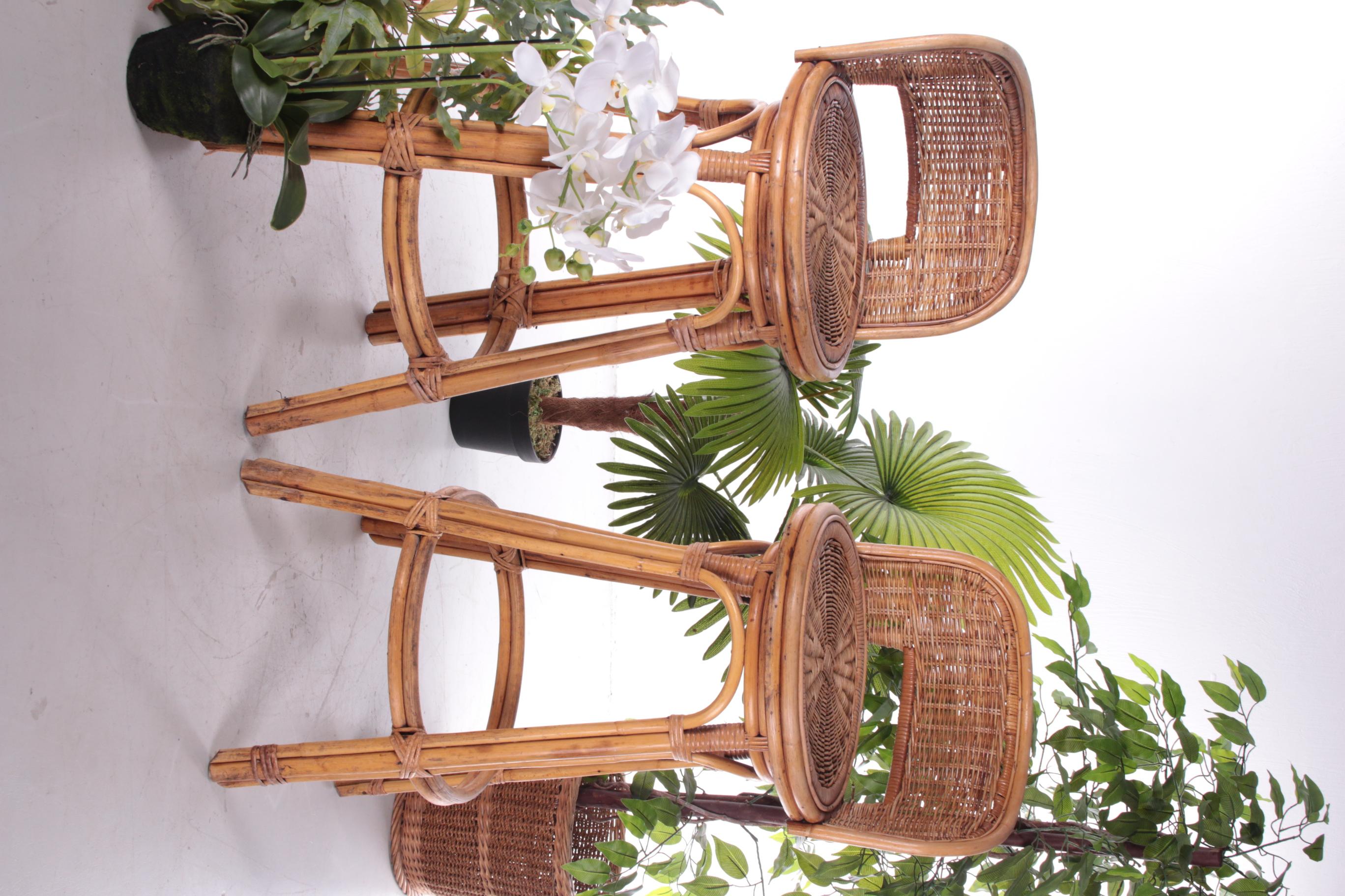 This nice set of two rattan bar stools with a rotating seat have the typical bohemian look. The set comes from the United States and was produced around the 1950s.

The sturdy bamboo frame still looks good for its age and can still last for ages.