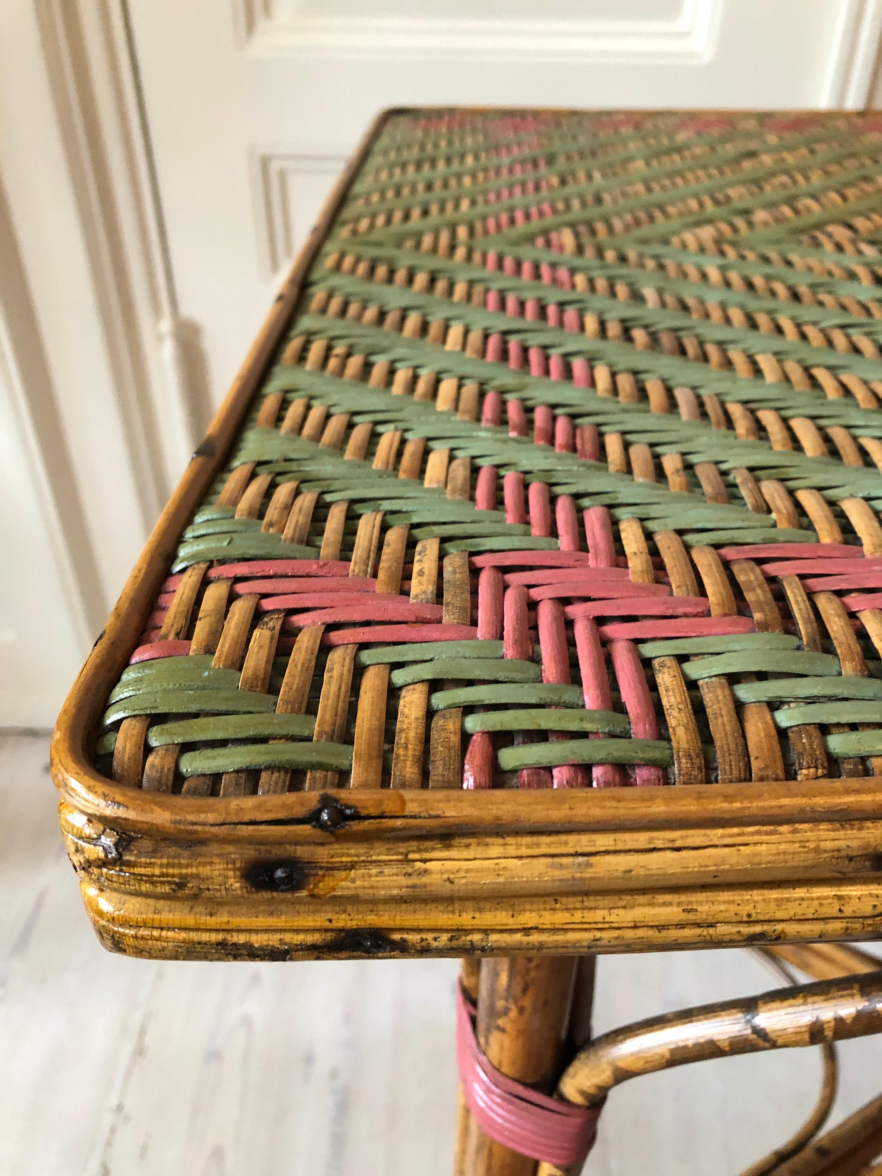 Mid-20th Century Vintage Rattan Table with Elegant Coral and Green Woven Details, France, 1930s