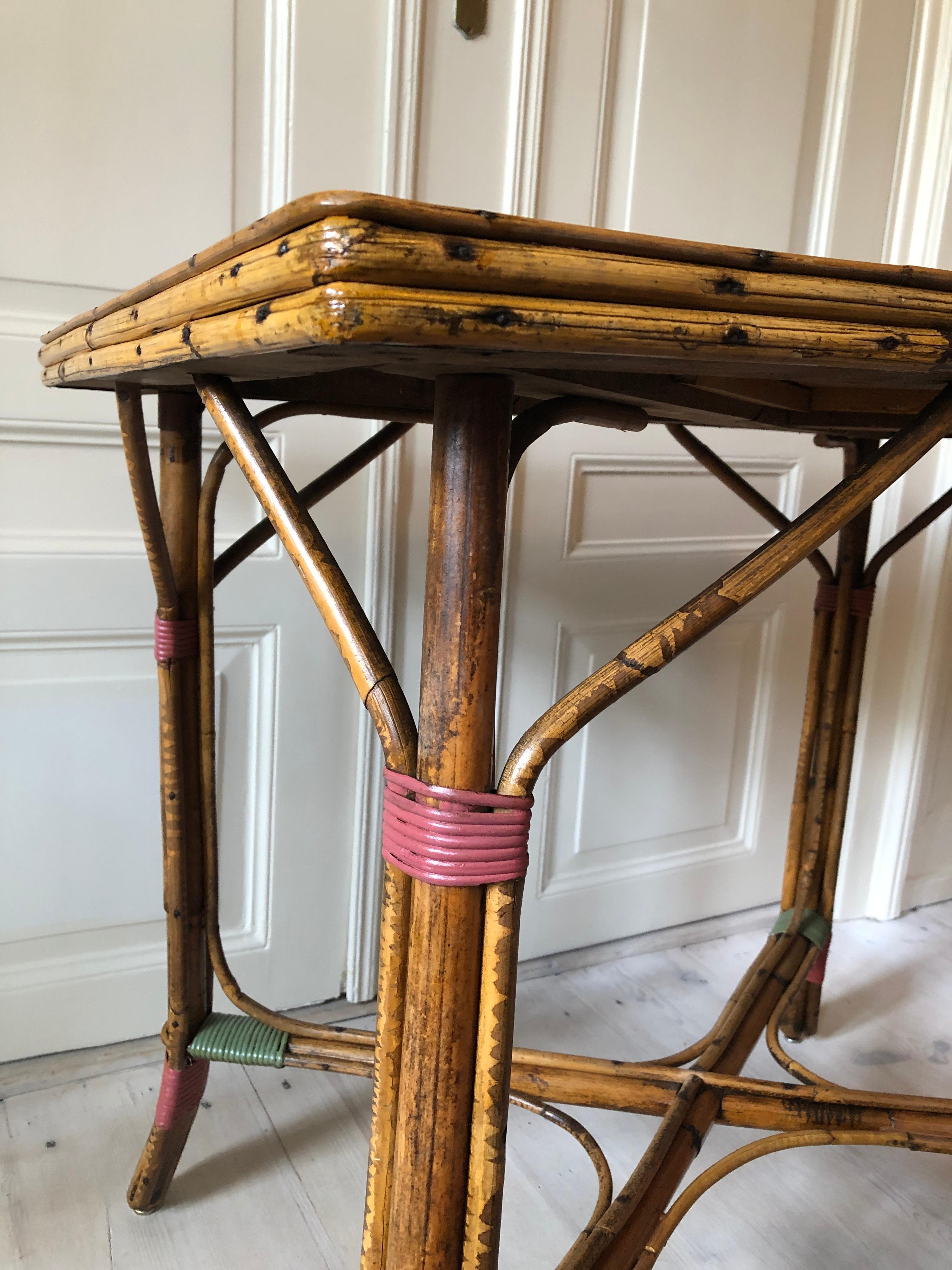 Vintage Rattan Table with Elegant Coral and Green Woven Details, France, 1930s 2