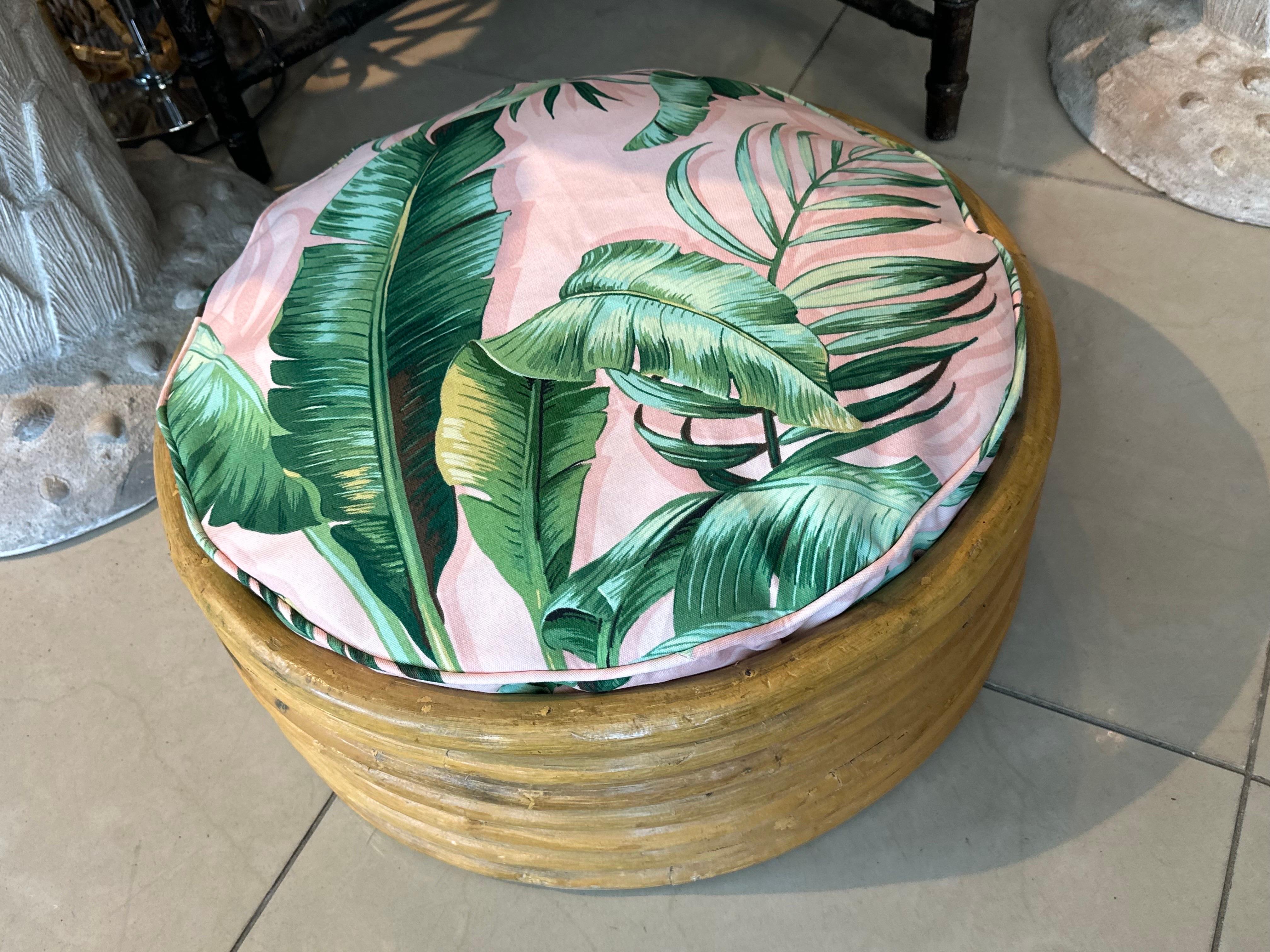 Beautiful vintage round rattan dog bed. Cushion has been custom made and is removable, washable with zippered cover for easy washing. Upholstery is outdoor fabric for durability. Dimensions: 9 H x 21 D. 