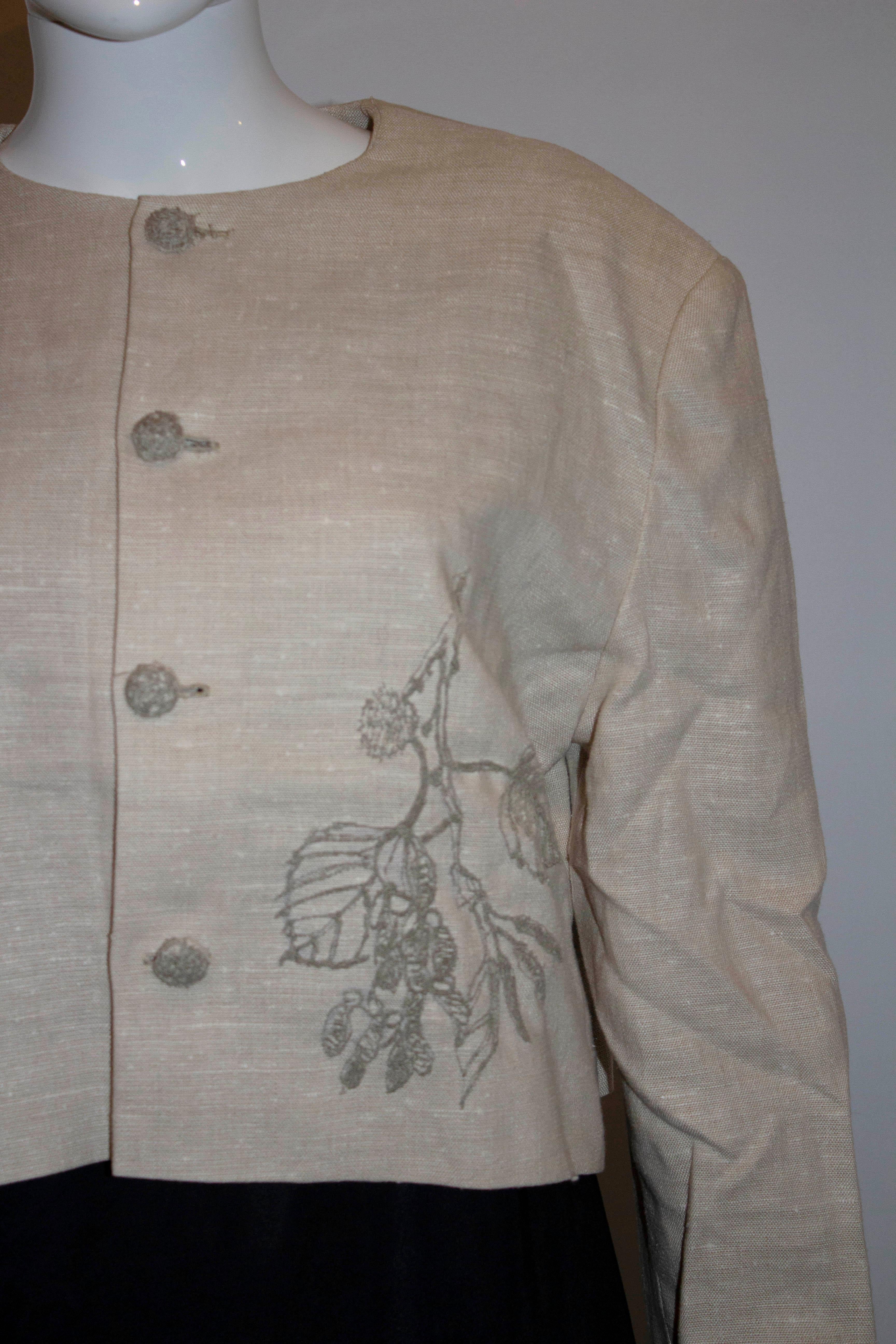 A pretty vintage jacket in a linen mix. The jacket has a round collar and button opening with embroidery detail on the left hand side. It is fully lined. 

Measurements: Bust up to 41'', length 20''
