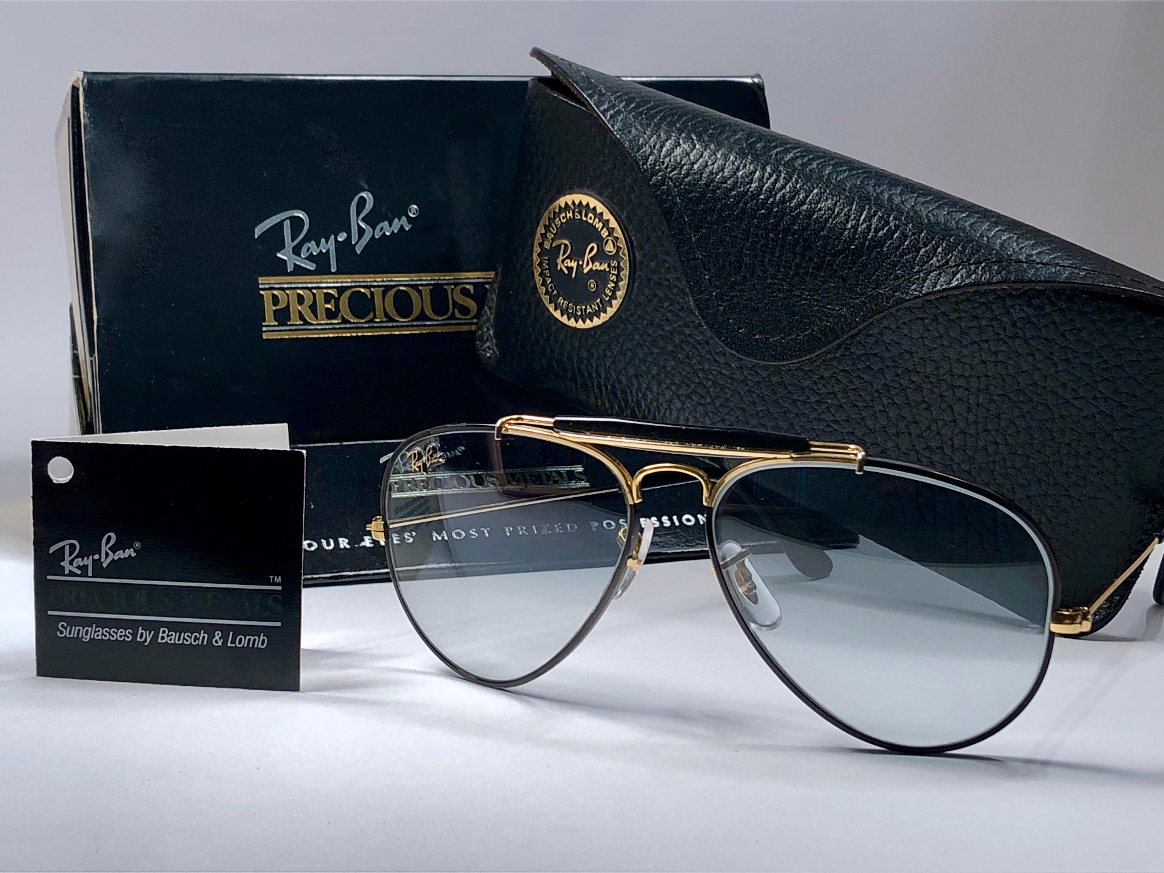 Collectors Item Precious Metals Outdoorsman in 62mm with original case. Full set.  Frame is 24 k gold plated and black coating.  The lenses are amazing blue changeable with a gradient and slight mirror. Ray Ban logo is on top of the right lens in