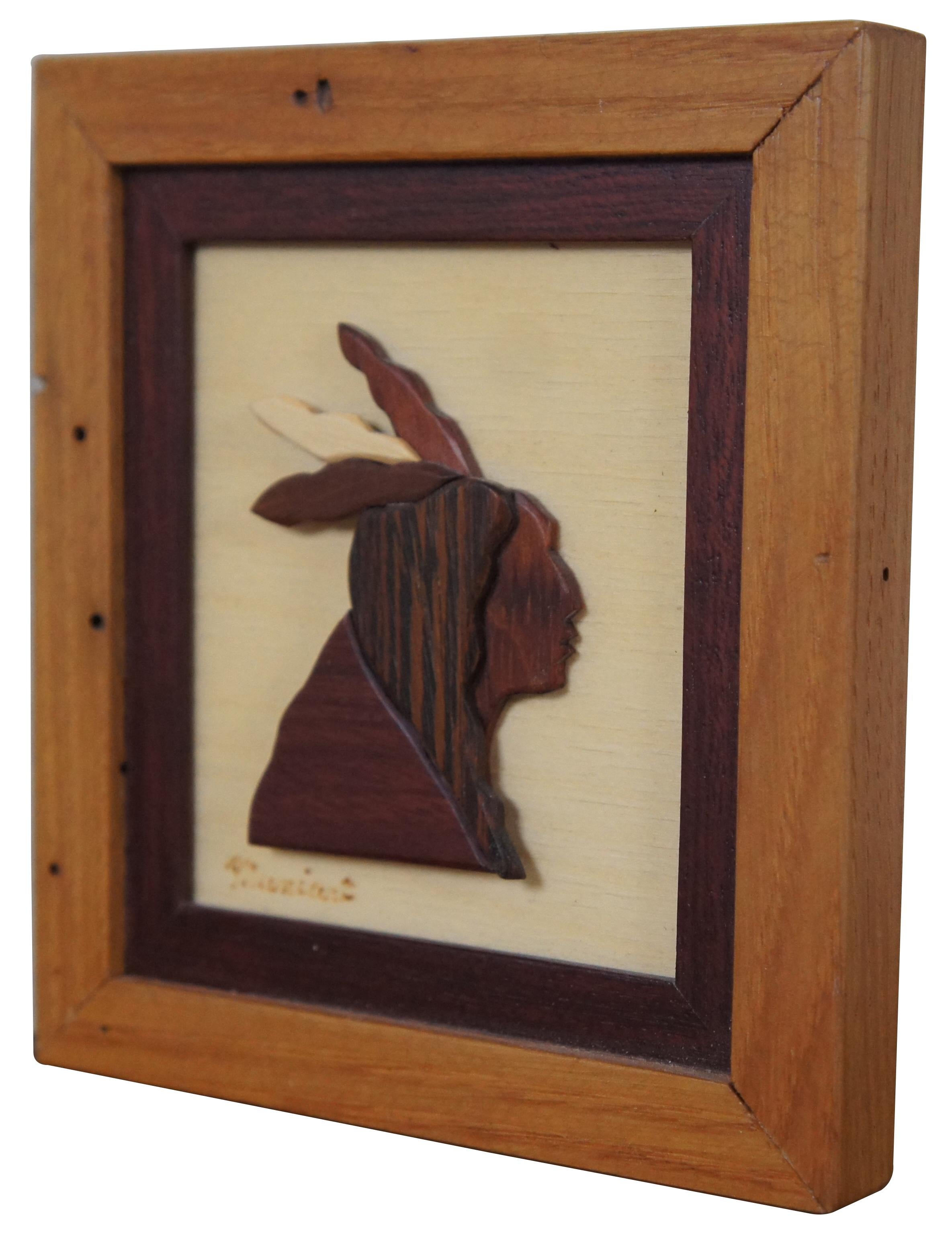 Vintage three dimensional layered wood art titled “Native American,” by Ray Muniak, December 1993. Crafted of layers of White Holly, Yellow Osage Orange, Brazilian Purpleheart, Wormy Chestnut, and Baltic Birch.

“Artist Ray Muniak . In 1981 Ray