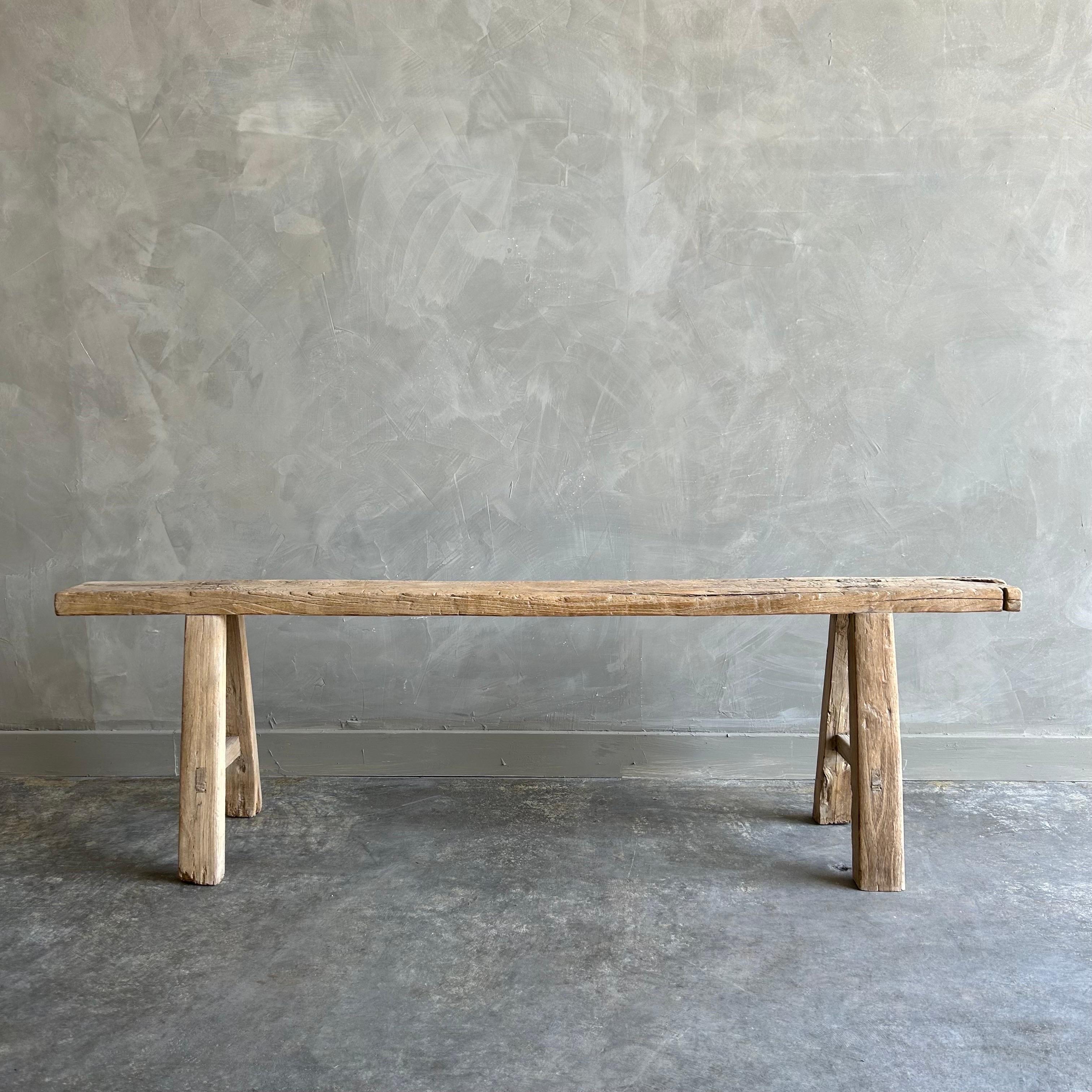 Bloom Home inc has over 2000 items in stock ready for immediate shipping, scroll down to view all of our items!
Vintage antique elm wood skinny bench. 
Size: 60”w x 12”d x 18”h
SD:5”
These are the real vintage antique elm wood benches! Beautiful