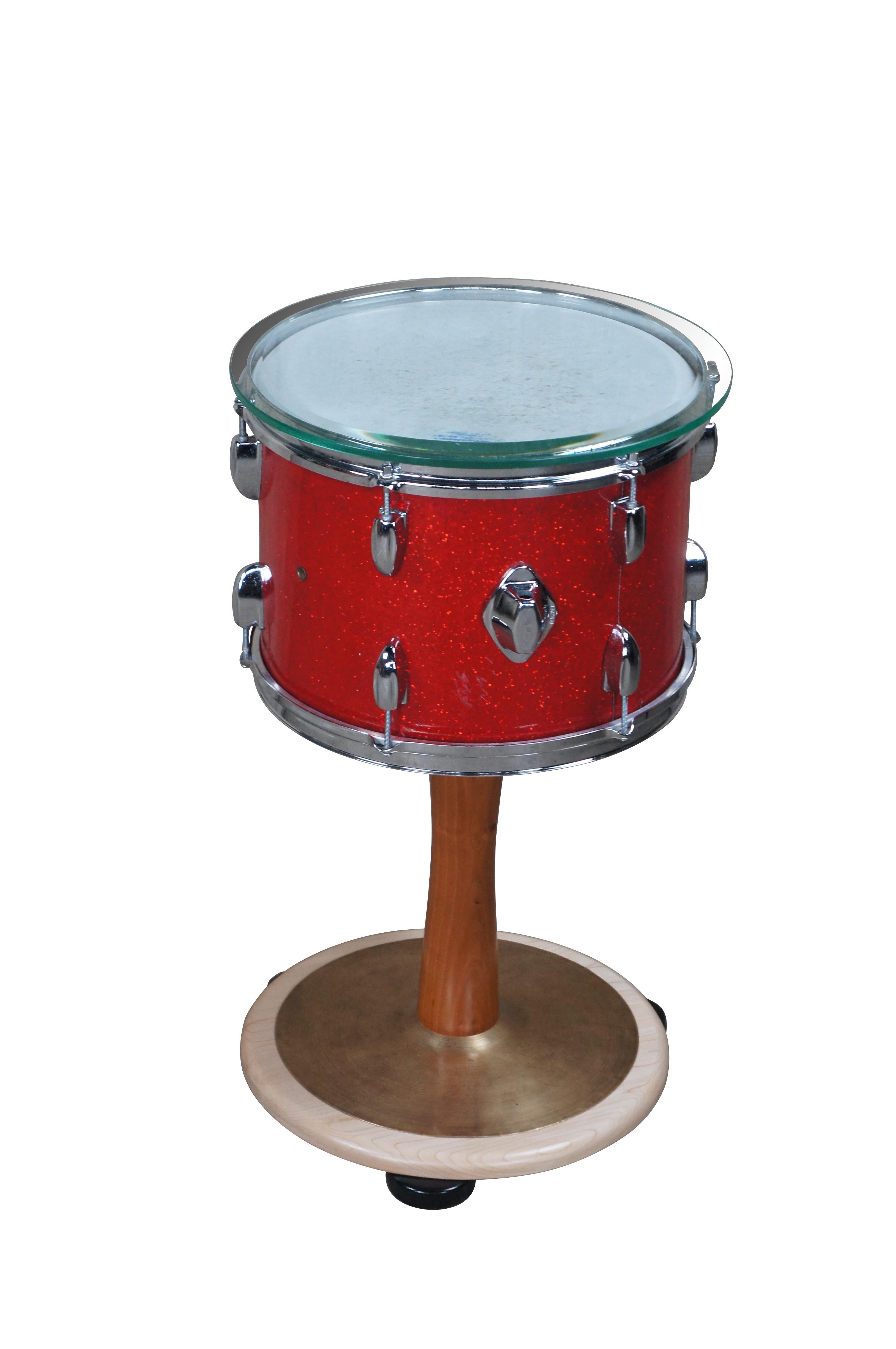 Vintage reclaimed / arts & crafts drum side table.  Made from an old Ludwig drum with red sparkle varnish, turned support and cymbal accent base.

Dimensions:
15