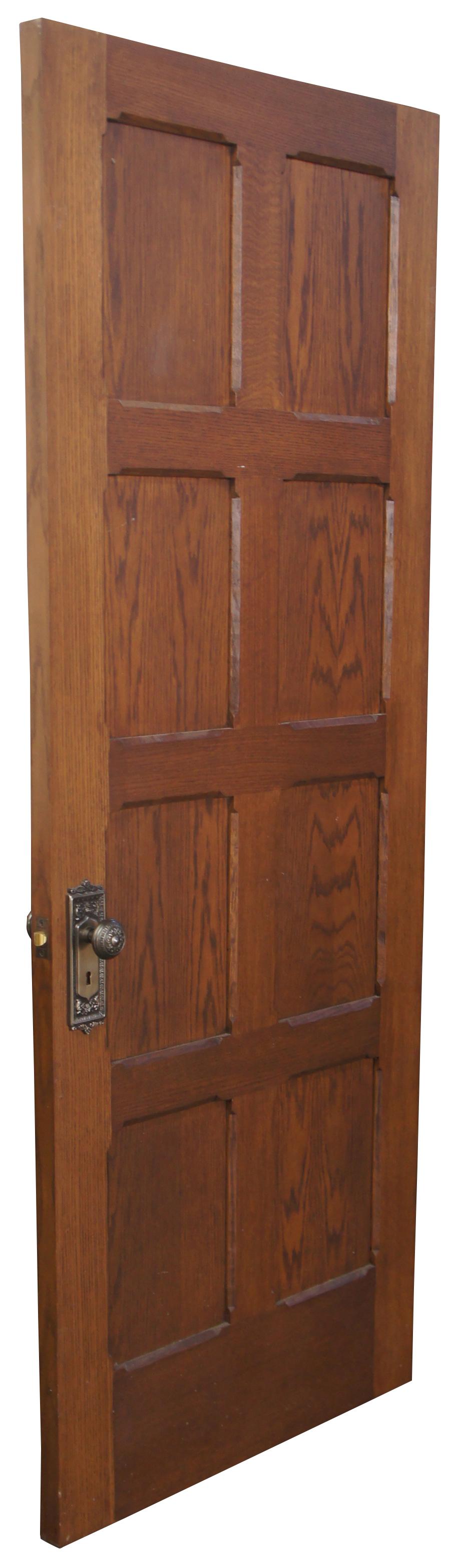 Vintage oak panel door. Features eight panels in a grid pattern with Spanish Revival design. Measures: 32” x 84”.
  