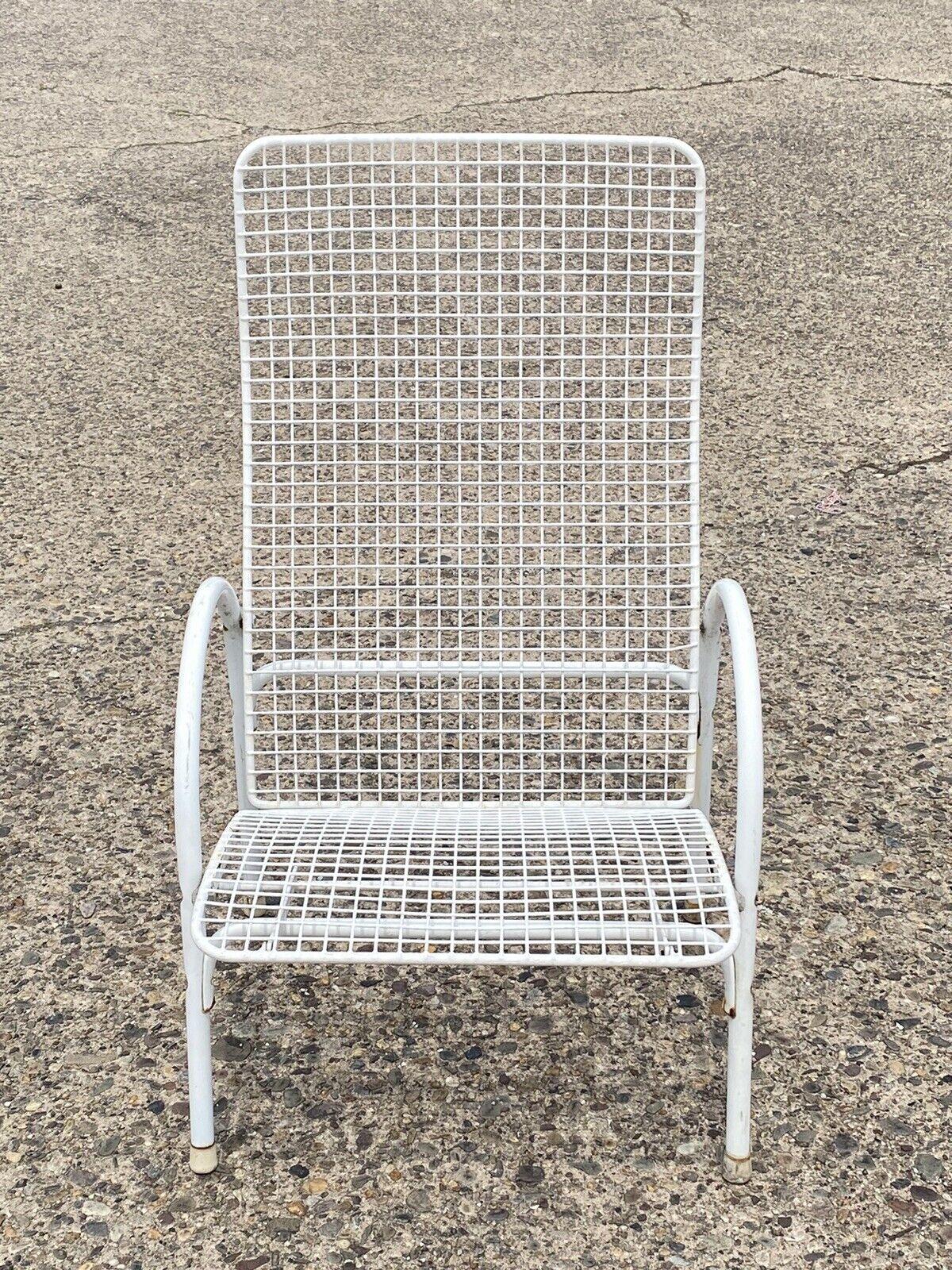 Vintage Reclining Wrought Iron Sculptural Mid Century Modern Patio Lounge Chair. Item features a steel and iron reclining frame with various settings, clean Modernist lines, sleek sculptural form. Circa Mid 20th Century. Measurements: 40