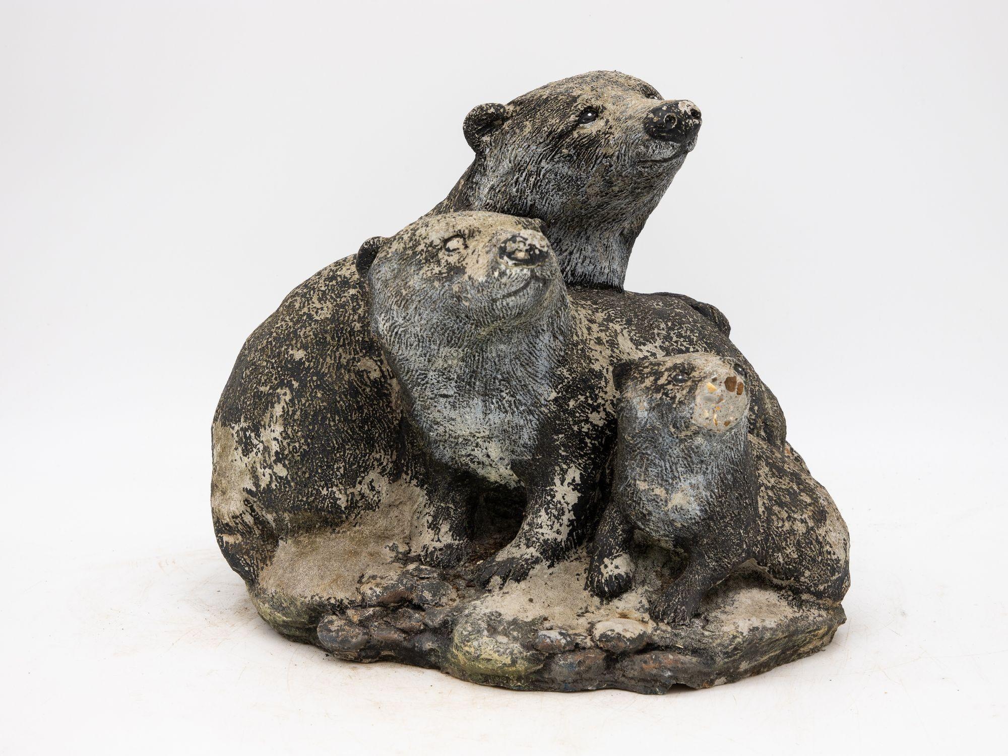 This mid-20th century Belgian garden ornament is a charming piece of artistry, showcasing three beautifully crafted badgers in varying sizes. Nestled on a bed of realistic rocks, these lifelike badgers exhibit exquisite attention to detail,