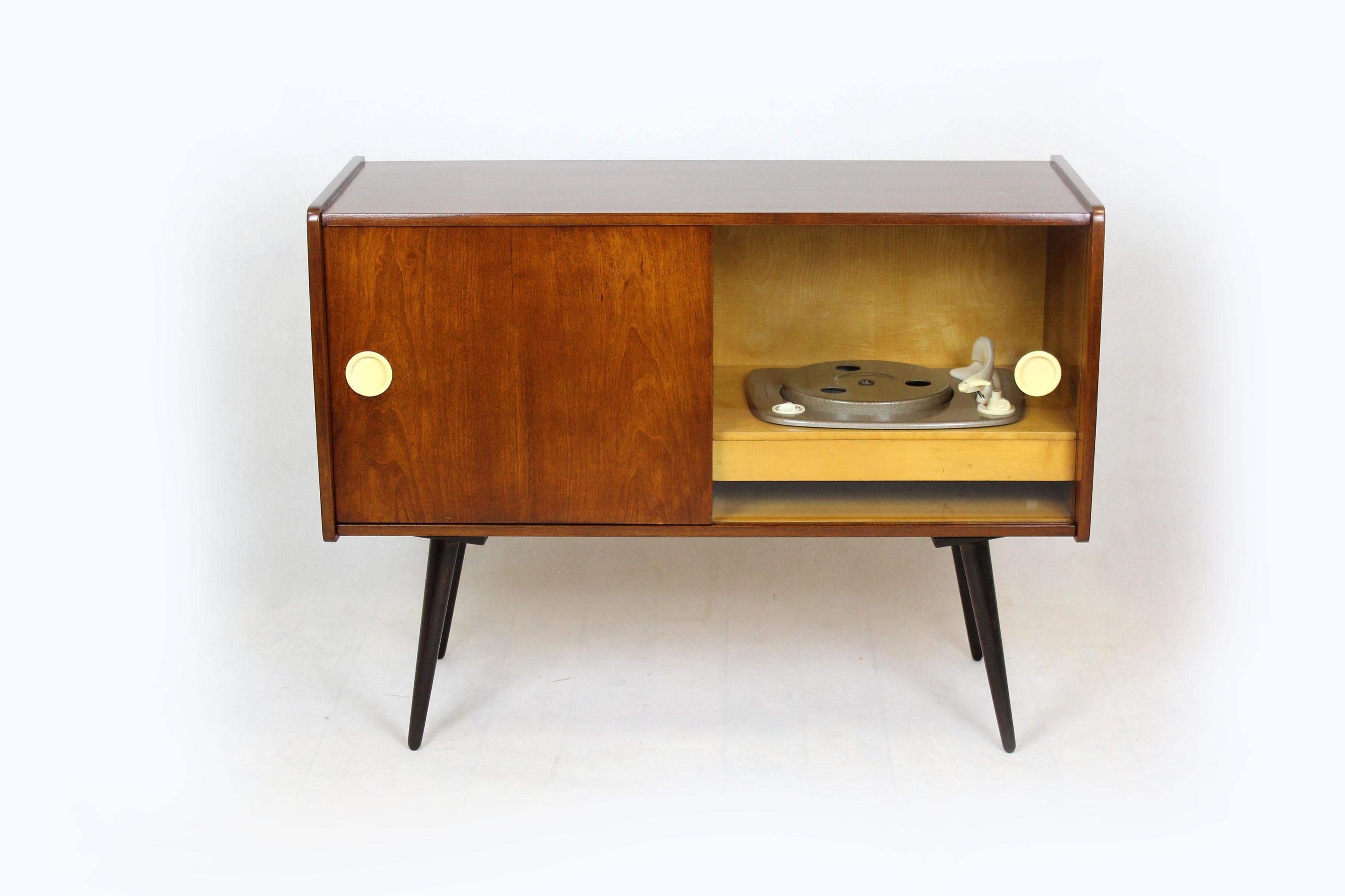 Record cabinet made by Supraphon in 1959.The cabinet has been restored and is in very good condition. The turntable has not been checked, it is not known if it works.