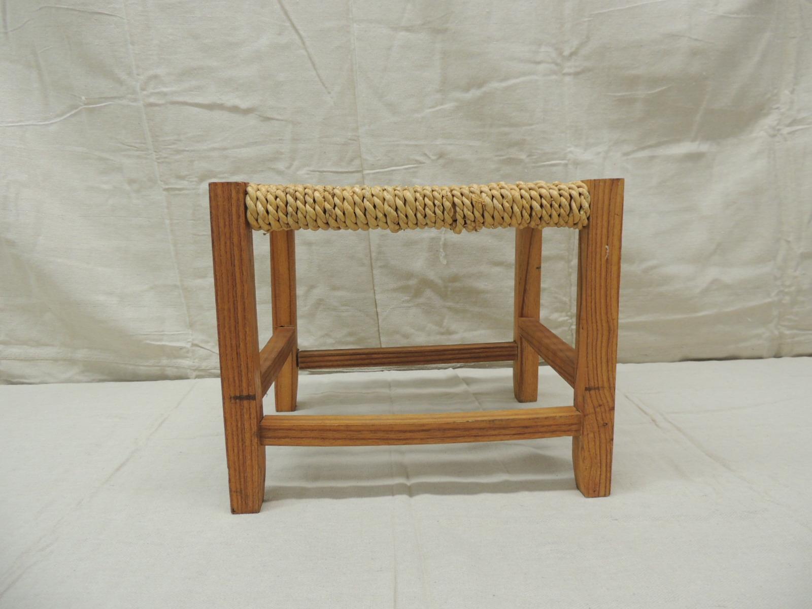 Vintage rectangular Shaker style footstool with seagrass woven seat
Stool has 4 wood squared legs with 4 square stretchers
Americana style with the center of the seat with an intricate braided designed fiber arts
Honey color. Organic. aka Rush