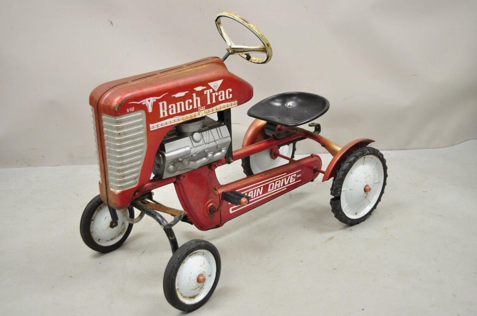 Vintage Red AMF Ranch Trac Chain Drive Pedal toy tractor. Circa Early to Mid 20th Century. Measurements: 26.5