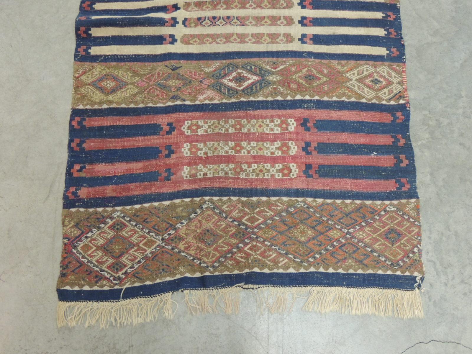 Vintage red and blue Kilim rug.
Size: 36