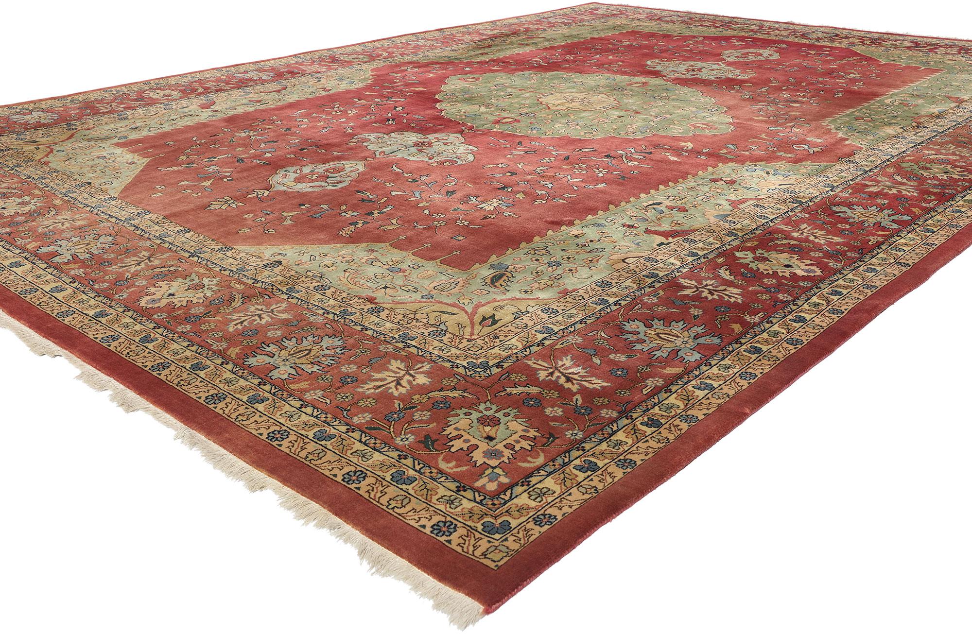 78897 Vintage Indian Agra Rug, 10'02 x 14'02. This hand-knotted wool vintage Indian Agra rug is a captivating masterpiece that embodies the rich heritage and exquisite craftsmanship of Indian rug-making traditions. The central medallion, a prominent