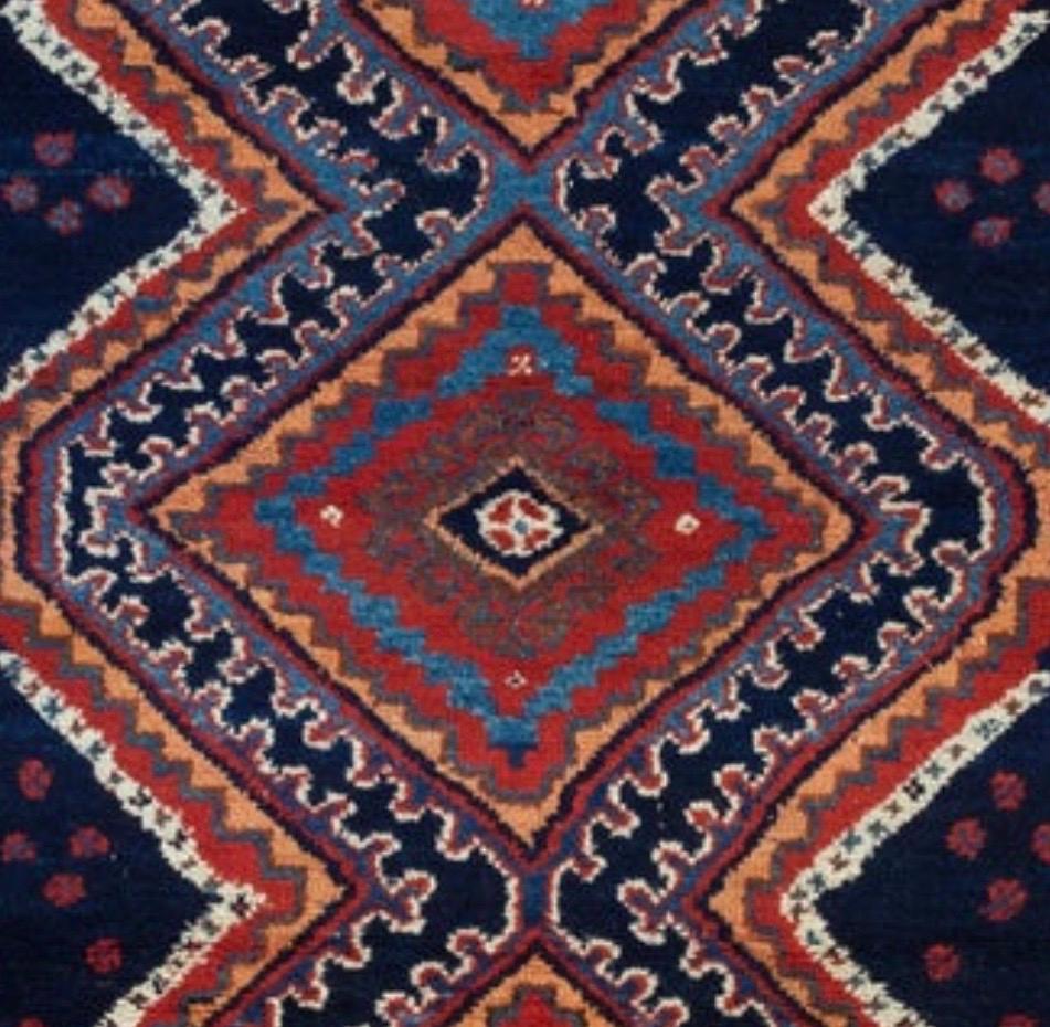 This is a lovely antique navy blue and ivory Persian Afshar rug hand knotted in Iran in the 1920s and measures: 4 x 5.5 ft.

 