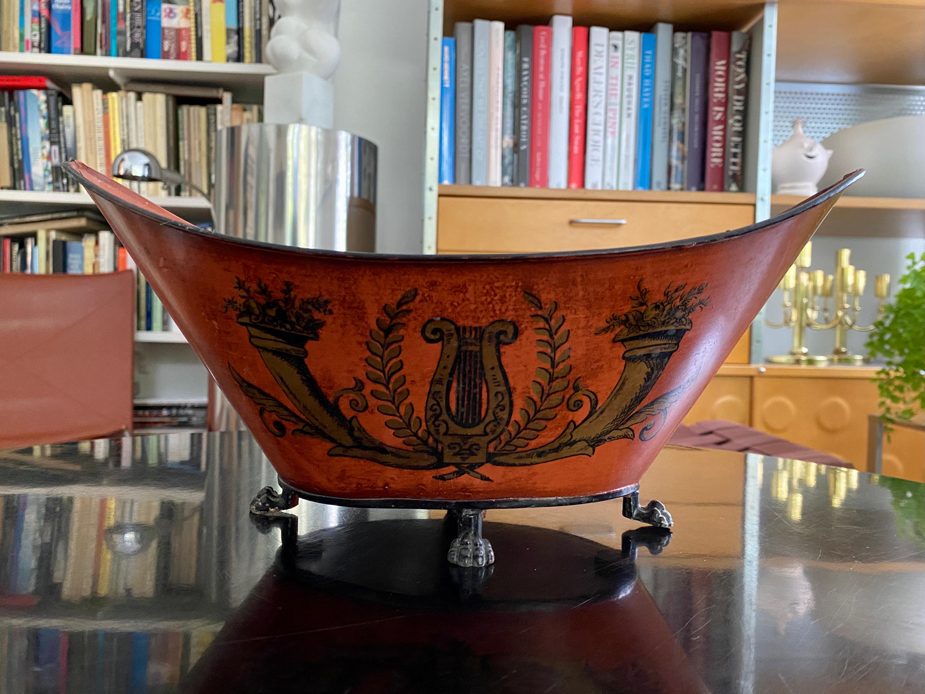 A vintage red / orange painted / stenciled toleware cache pot. Beautiful regency design with lyre and cornucopias , probably made in the 1950s / 1960s. Some markings noted on the bottom, appears to be 
