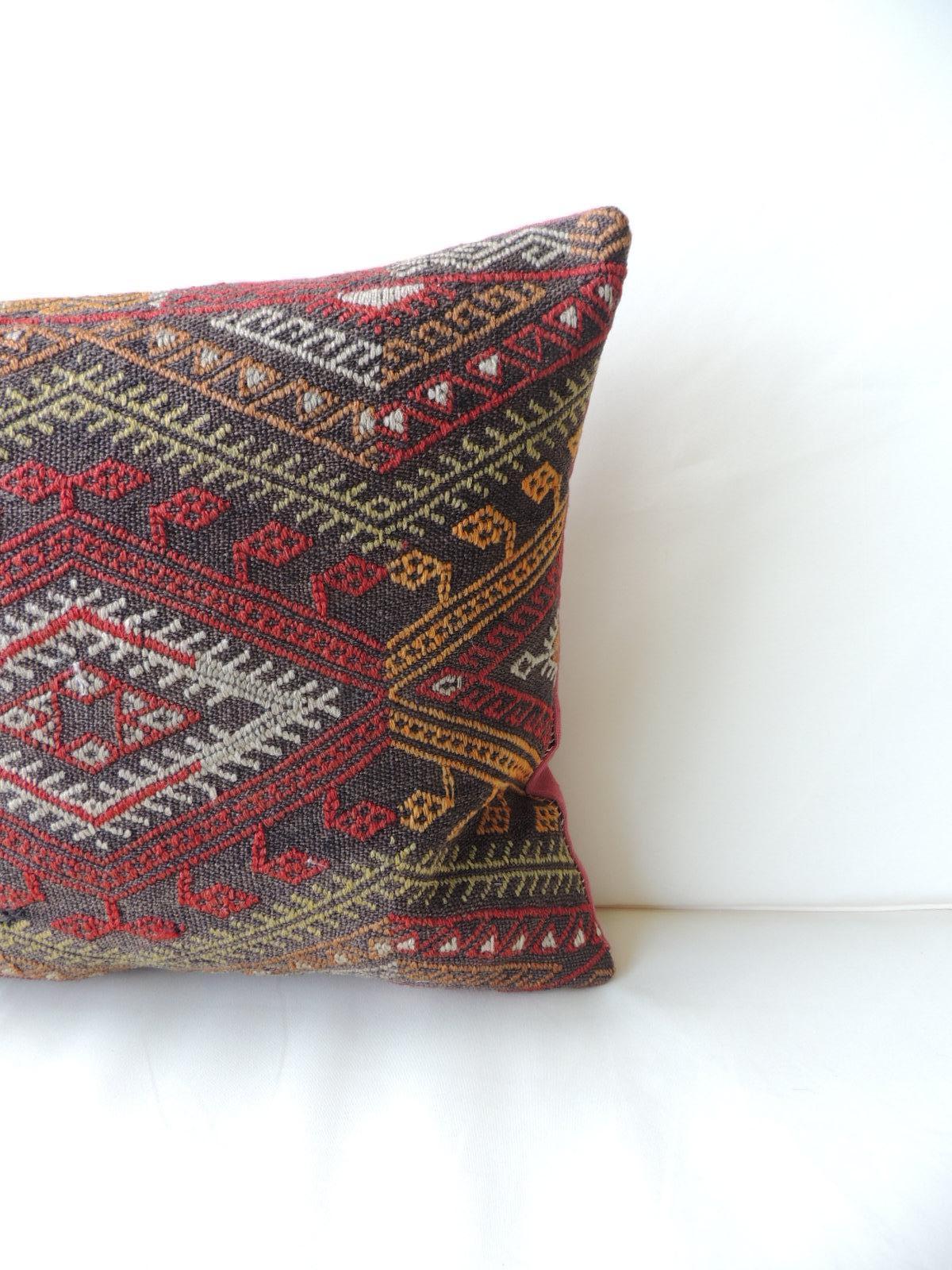 Vintage red and orange woven Kilim bolster decorative pillow
with pinkish linen backing.
Decorative pillow handcrafted and designed in the USA. Closure by stitch (no zipper closure) with custom made pillow insert.
In shades of red, grey, black,