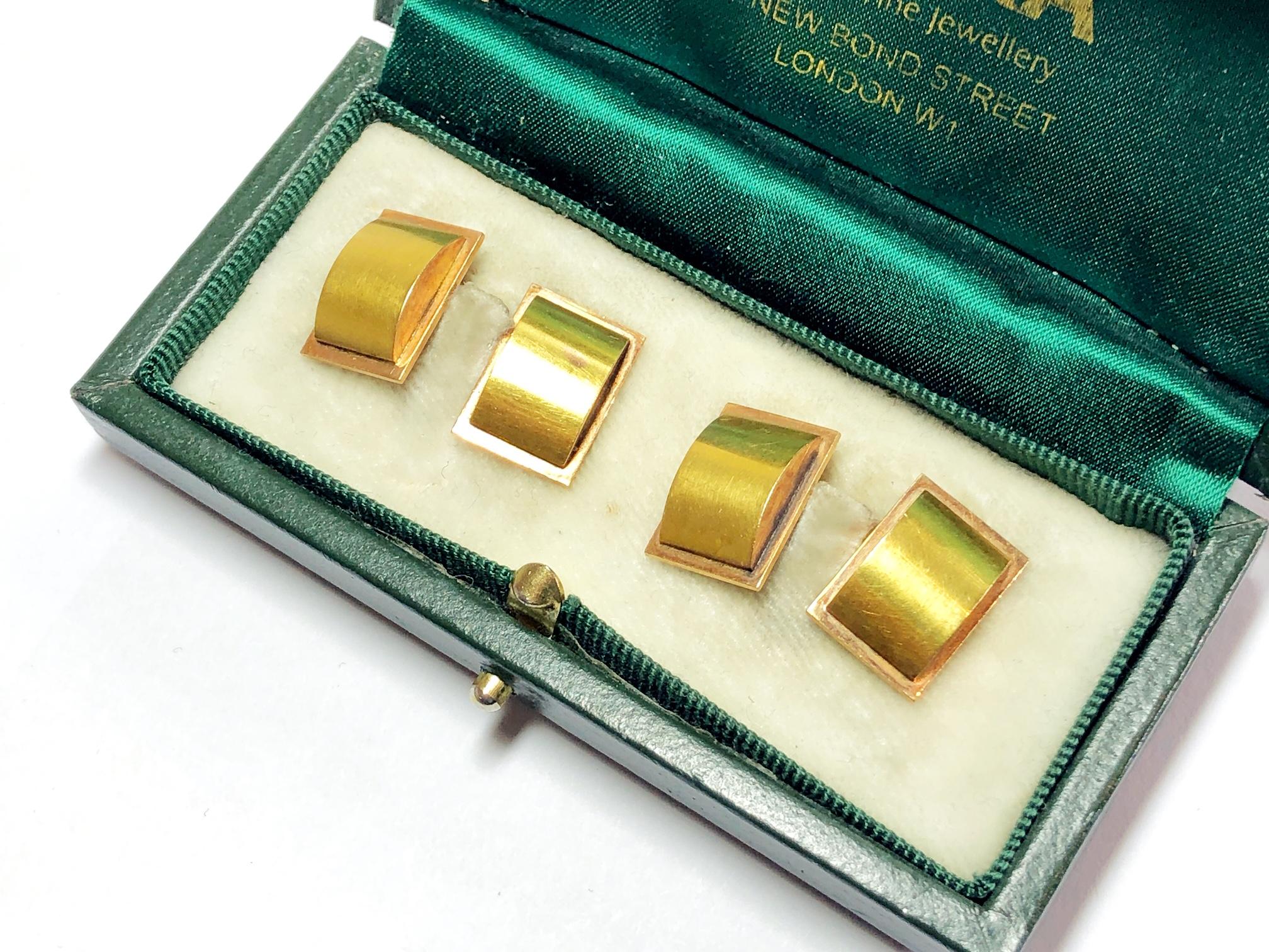 A pair of vintage, rectangular, two-colour gold cufflinks, with red gold rectangular back plates and yellow gold domed curves, circa 1945.