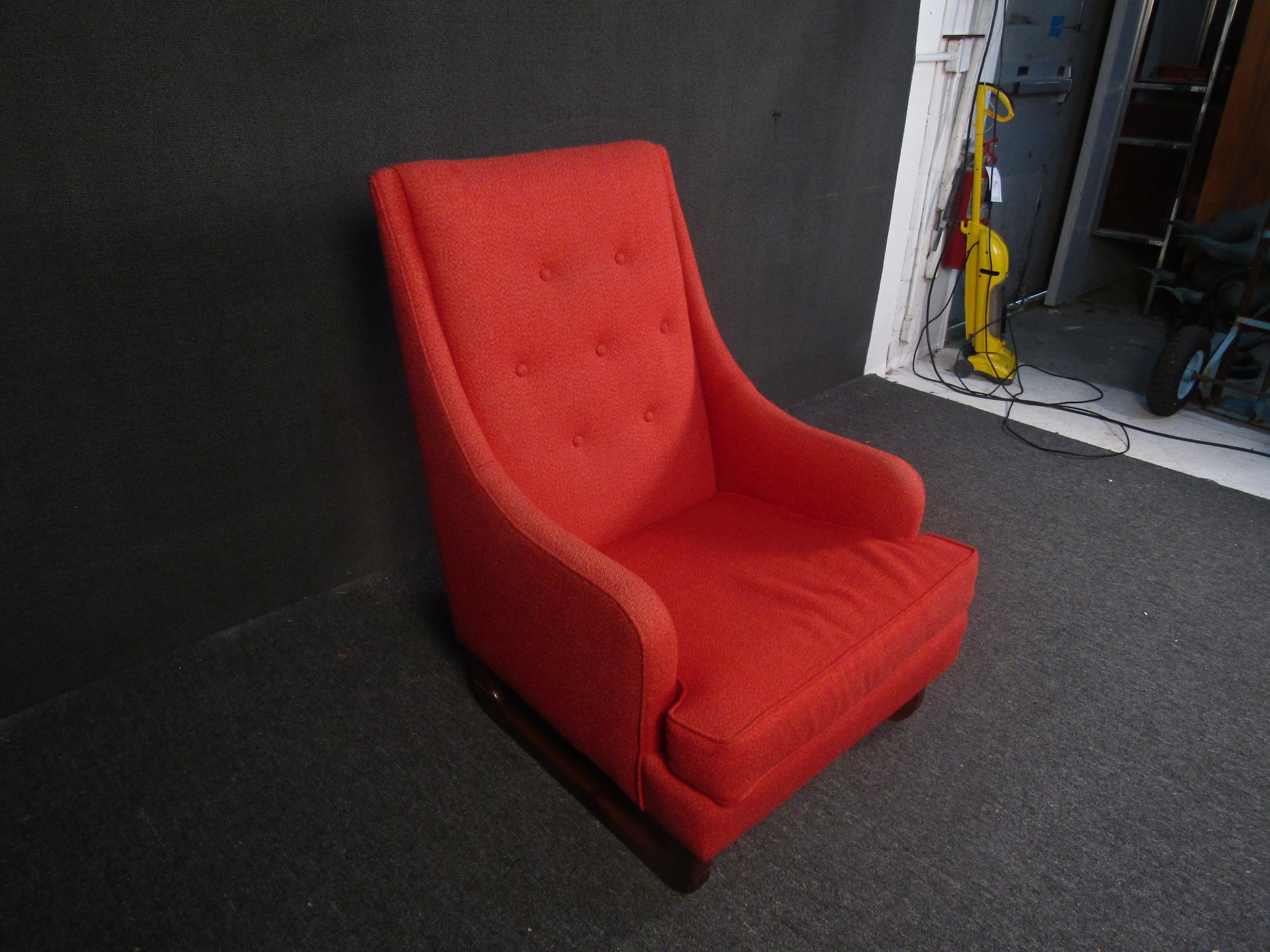 Beautiful and comfortable vintage armchair styled after the designs of Adrian Pearsall. Vivid red upholstery is paired with rich wooden legs to stunning effect, while a comfortable cushioned design makes this perfect for any reading room or living