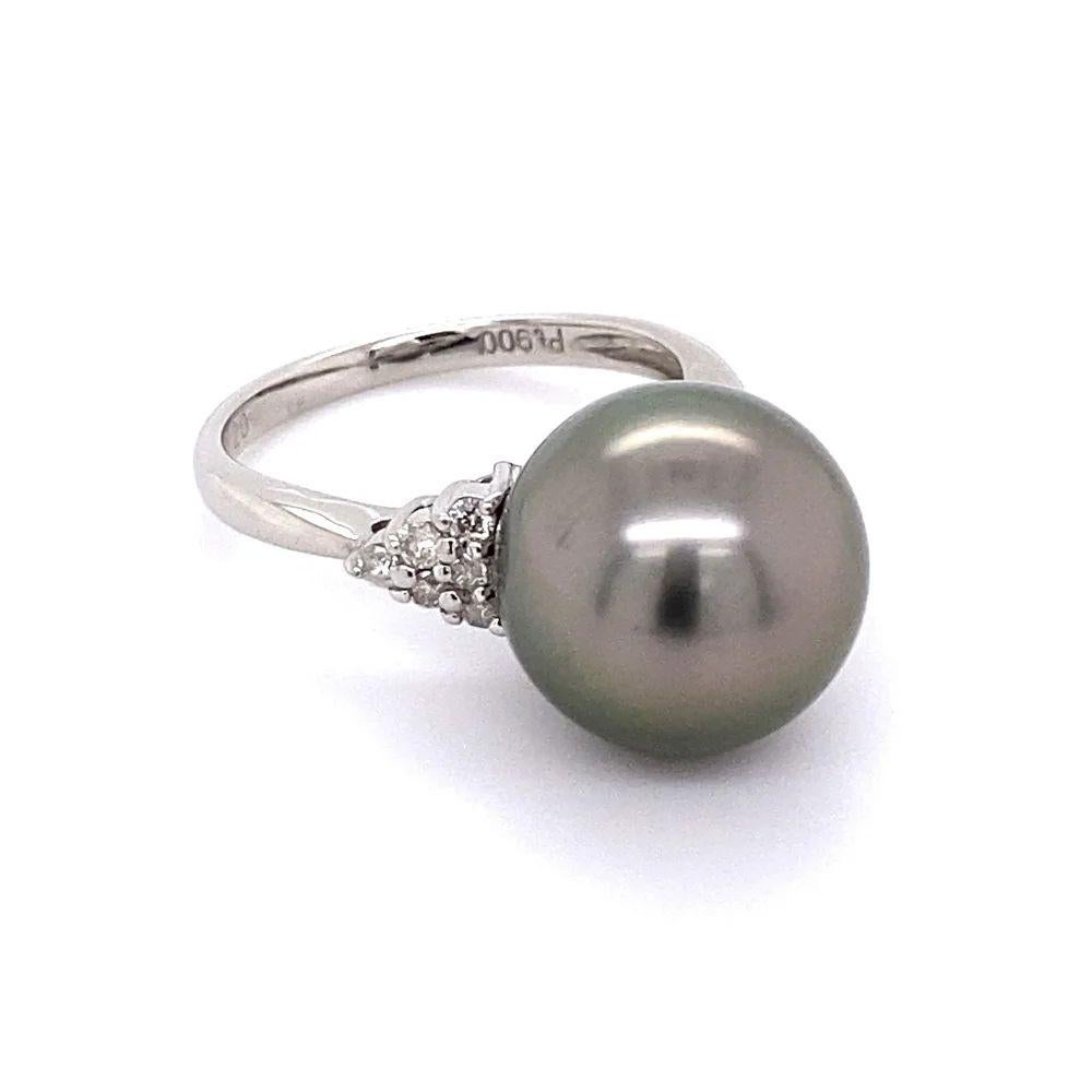 Simply Beautiful! Stylish Finely detailed Show Stopper Gray Pearl and Diamond Statement Platinum Ring. Centering a 12.3mm Grey Pearl, accented by 5 Hand set round Diamonds, weighing approx. 0.20tcw. Ring size 6, we offer ring resizing. Hand crafted