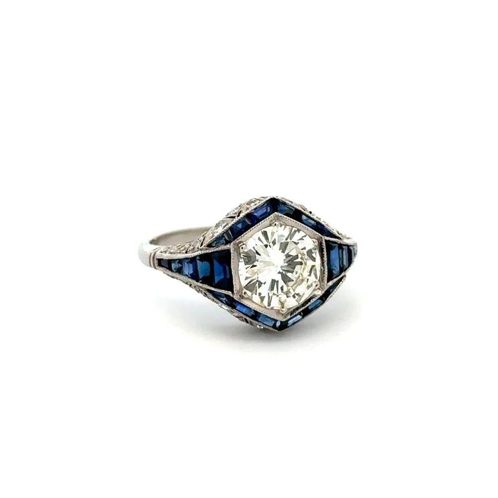Simply Beautiful! Finely detailed Show Stopper Diamond and Blue Sapphire Statement Platinum Cocktail Ring. Centering a securely nestled Hand set 1.48 Carat Round Brilliant Cut Diamond. Surrounded by Blue Sapphires, weighing approx. 1.56tcw and