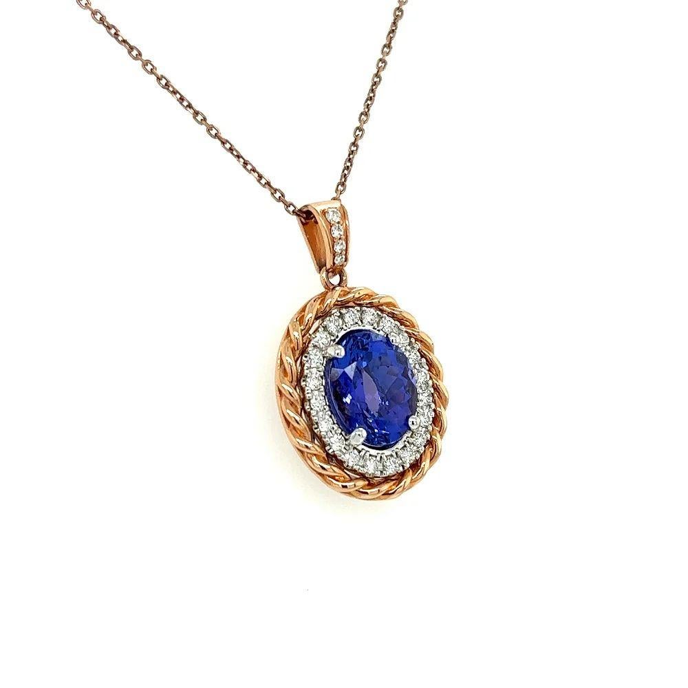 Simply Beautiful! Finely detailed Show Stopper Signed S. Fiori Tanzanite and Diamond Gold Halo Vintage Pendant Necklace. Centering a Hand set 4.44 Carat Oval Tanzanite. Surrounded by Diamonds weighing approx. 0.54tcw. Pendant measures approx. 1.2” l