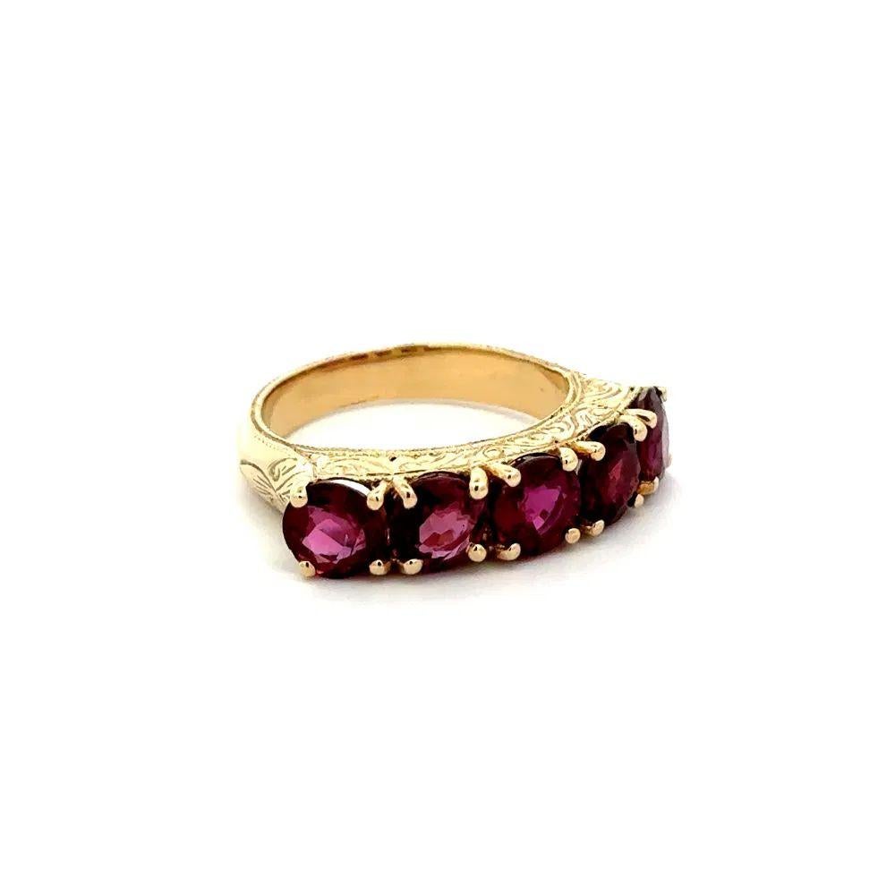 Simply Beautiful! Red Carpet Vintage 5-Stone Ruby Statement Gold Band Ring. Finely Hand crafted 14K Yellow Gold engraved mounting. Securely nestled Hand set with 5 Rubies, weighing approx. 4.44tcw. Ring size 6.75, we offer ring re-sizing. The ring