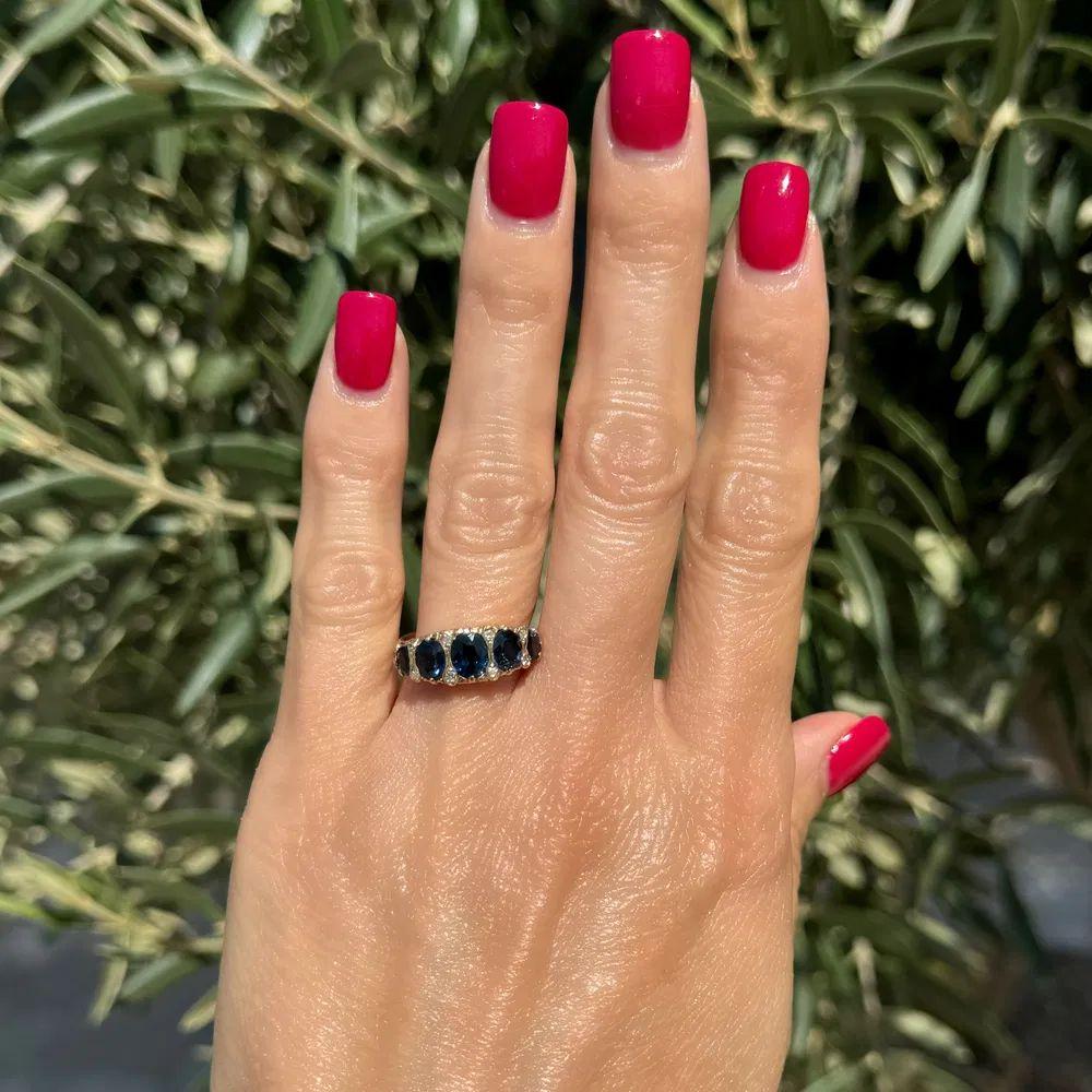 Modernist Vintage Red Carpet 5 Stone Sapphire and Diamond Gold Band Ring For Sale