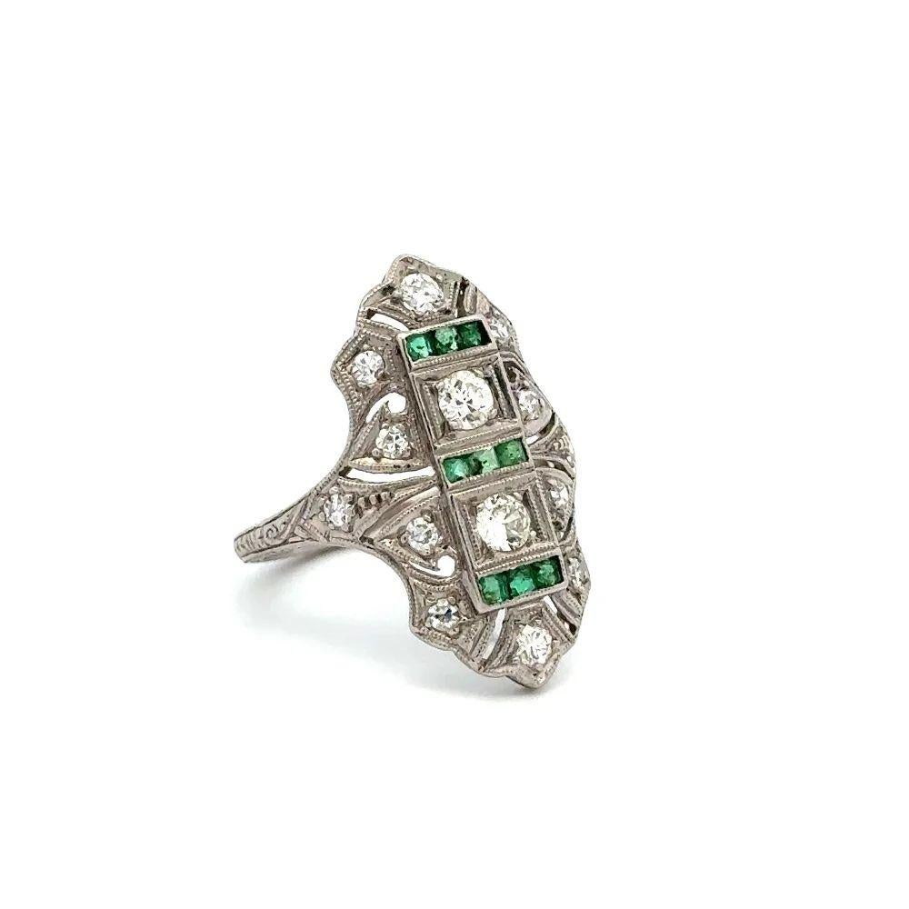Simply Beautiful Show Stopper! Finely detailed Old European Cut Diamond and Emerald Platinum Navette Statement Cocktail Ring. Centering a securely nestled Hand set 0.60tcw Old European Cut Diamonds. Surrounded by Diamonds and Green Emeralds, approx.