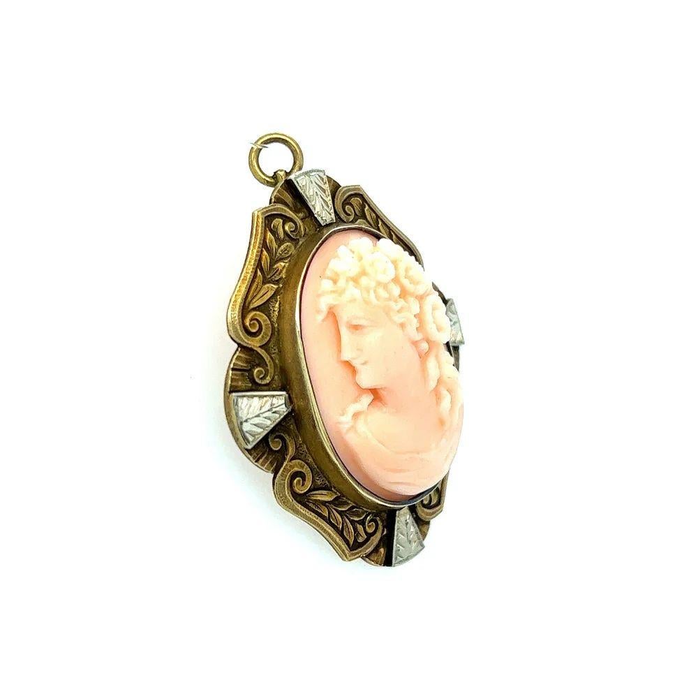 Simply Beautiful! Finely detailed Antique Hand Carved Coral Cameo Brooch Pendant. Featuring the Profile of a Beautiful Young Woman. The Hand Carved Oval Coral Cameo is securely Hand set in a Hand crafted Engraved 2-tone 14K Yellow and White Gold