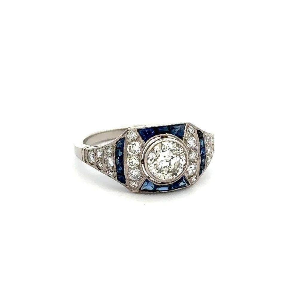 Simply Beautiful! Finely detailed Show Stopper Diamond and Sapphire Platinum Cocktail Ring. Centering a securely Hand set 0.76 Carat Diamond, surrounded by Diamonds, weighing approx. 0.55tcw and Blue Sapphires, approx. 0.48tcw. Hand crafted Milgrain