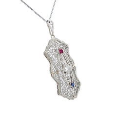 Collana con ciondolo d'oro con diamanti, zaffiri e rubini Red Carpet d'epoca