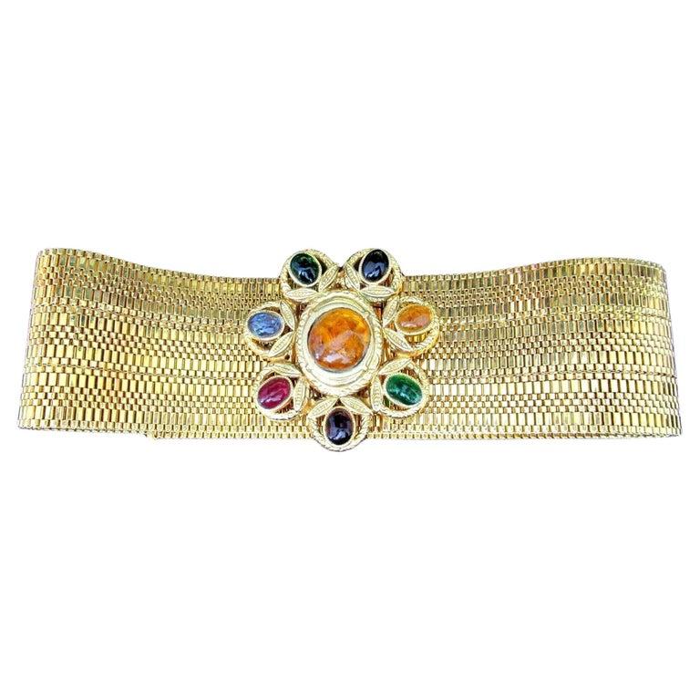 Simply Fabulous! Vintage Iconic Signed Designer Chanel Red Carpet Large Faux Gem Golden Statement Belt. Large decorated Clasp centering a Hand set Oval Cabochon in Faux Amber, radiating 7 smaller Faux Gem Cabs in Faux Emerald, Ruby, Aquamarine and