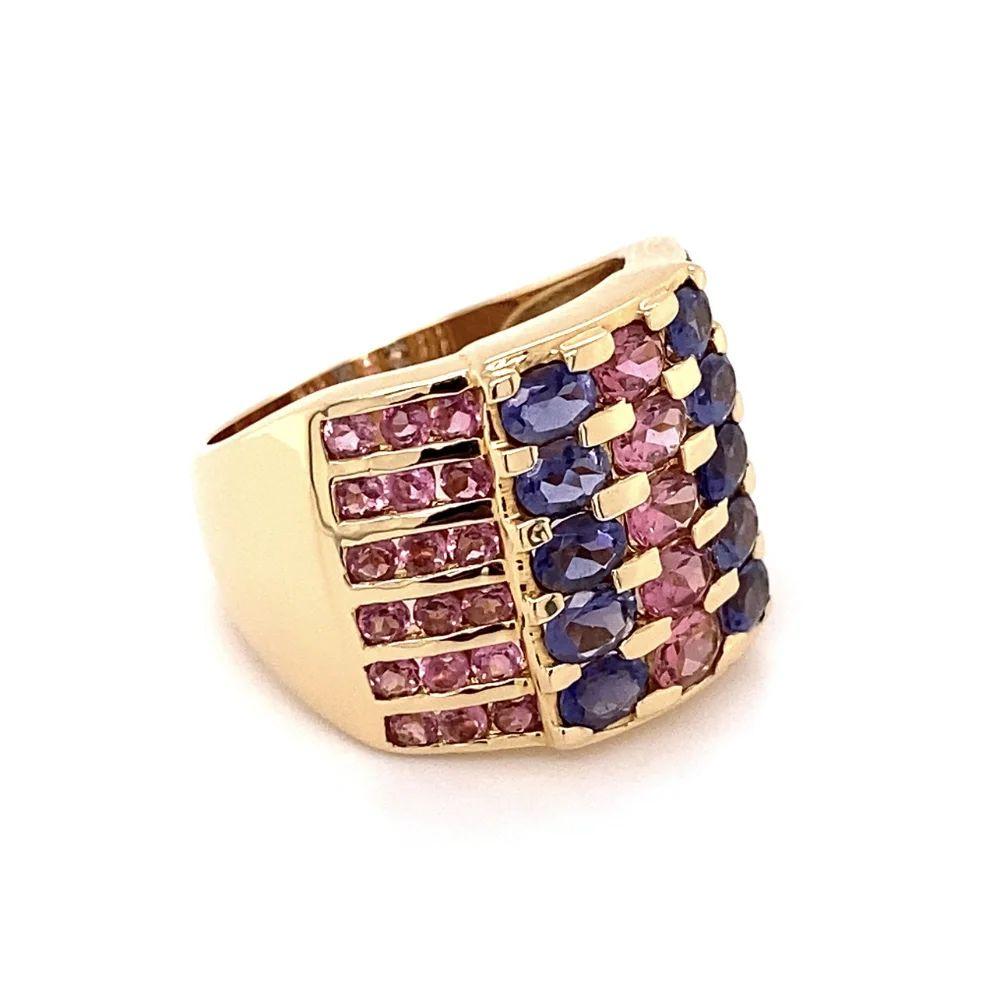 Simply Beautiful! Vintage Oscar Worthy Pink Tourmaline and Tanzanite Gold Band Ring. Six rows securely Hand set with Pink Tourmaline, weighing approx. 3.00tcw and Tanzanite. Hand crafted in 14K Yellow Gold. Measuring approx. 0.97” w x 0.95” w x